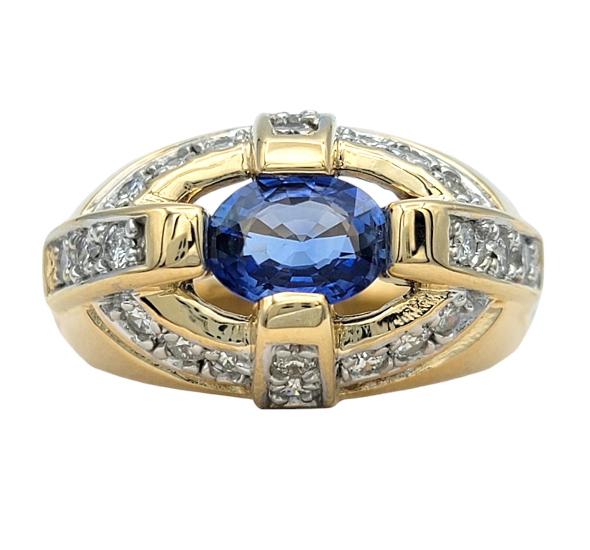 Contemporary East-West Oval Cut Blue Sapphire Dome Ring with Diamonds in 14 Karat Yellow Gold For Sale