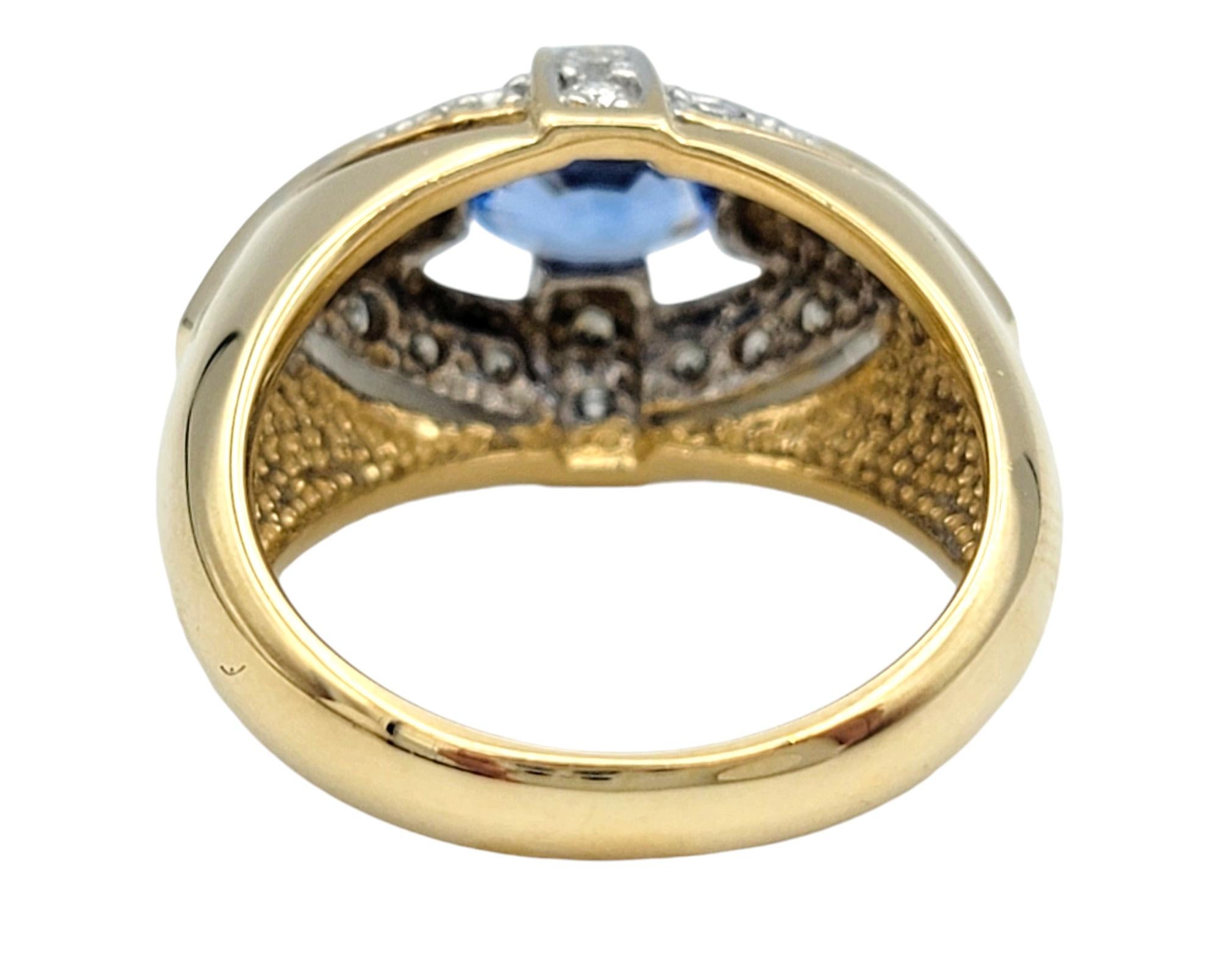 East-West Oval Cut Blue Sapphire Dome Ring with Diamonds in 14 Karat Yellow Gold For Sale 3