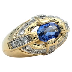 East-West Oval Cut Blue Sapphire Dome Ring with Diamonds in 14 Karat Yellow Gold