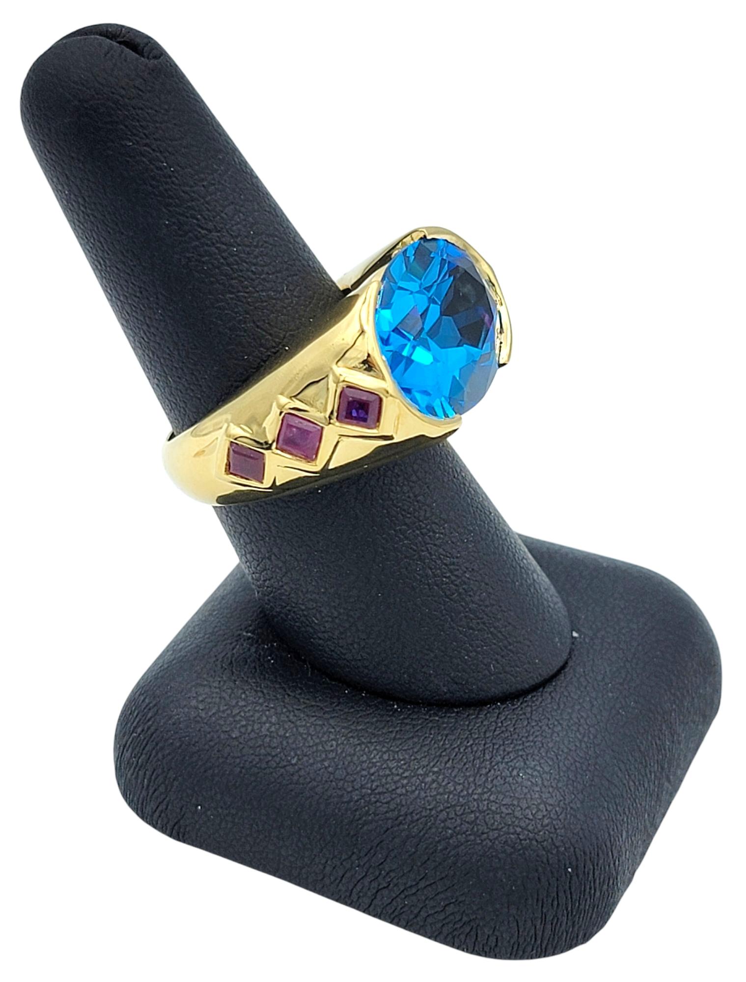 East West Oval Cut Blue Topaz Cocktail Ring with Rubies in 18 Karat Yellow Gold For Sale 6