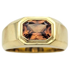 East West Rectangular Cut Mandarin Garnet Solitaire Ring in 18 Karat Yellow Gold