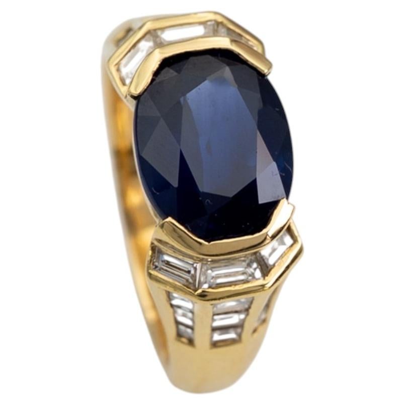 Anello Est-Ovest con zaffiro e diamante in oro giallo 18 carati
