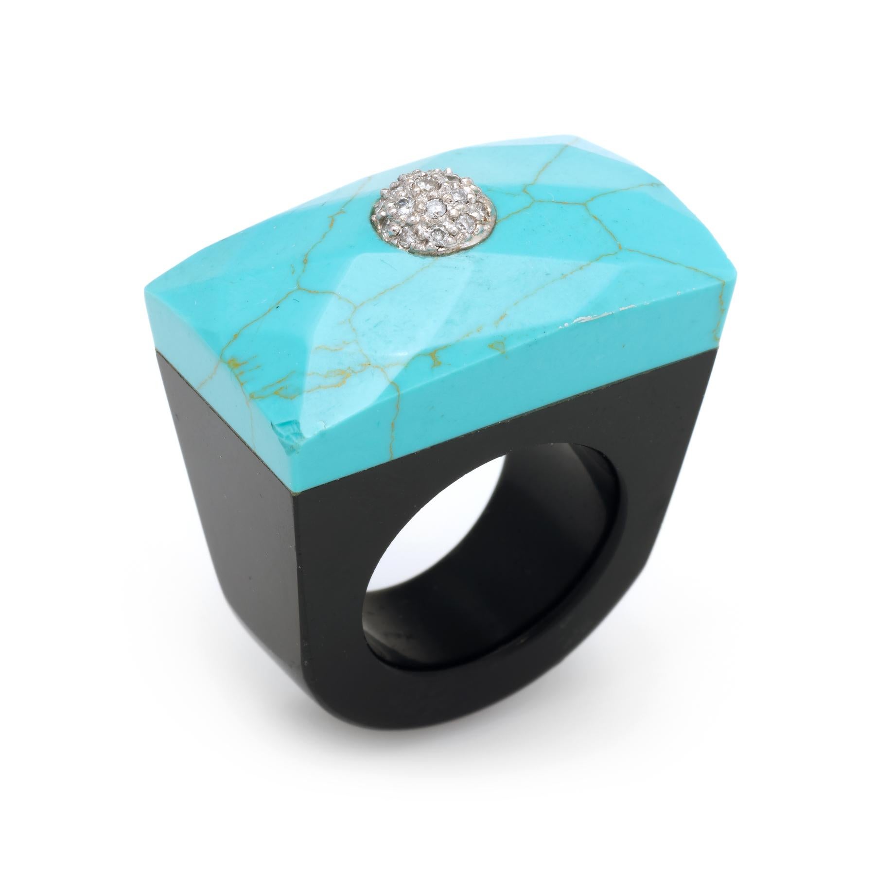Large statement east west cocktail ring, finished with a pave diamond dome in 18 karat white gold. 

Centrally mounted pave set diamonds total an estimated 0.10 carats (estimated at I-J color and SI1-2 clarity). The turquoise measures 31mm (1.22