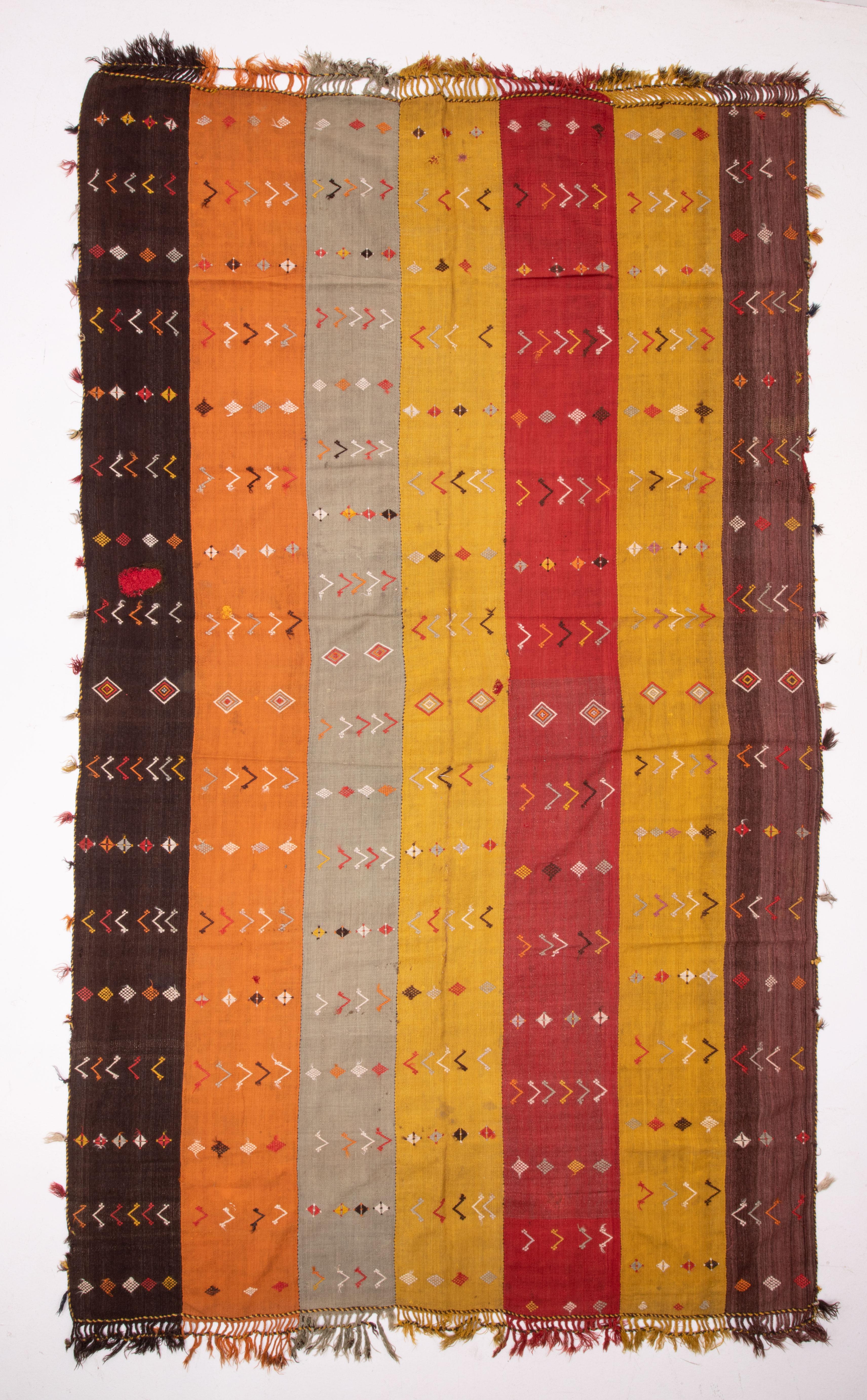 A wonderfully colorful cicim verde from Eastern Anatolia, Turkey. It is embellished with cicim technique from the traditional design pool. 
It has one rustic repair done to it.
