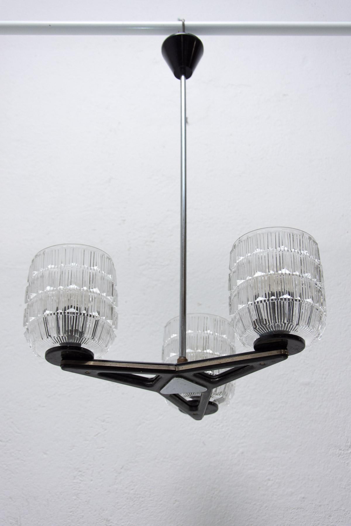 This chandelier was made in the 1970´s in the former Czechoslovakia by LIDOKOV company.

It is made of cut glass, chrome and metal.

Original fully functional wiring, cleaned, in good Vintage condition.

Works with three E27 bulb.

