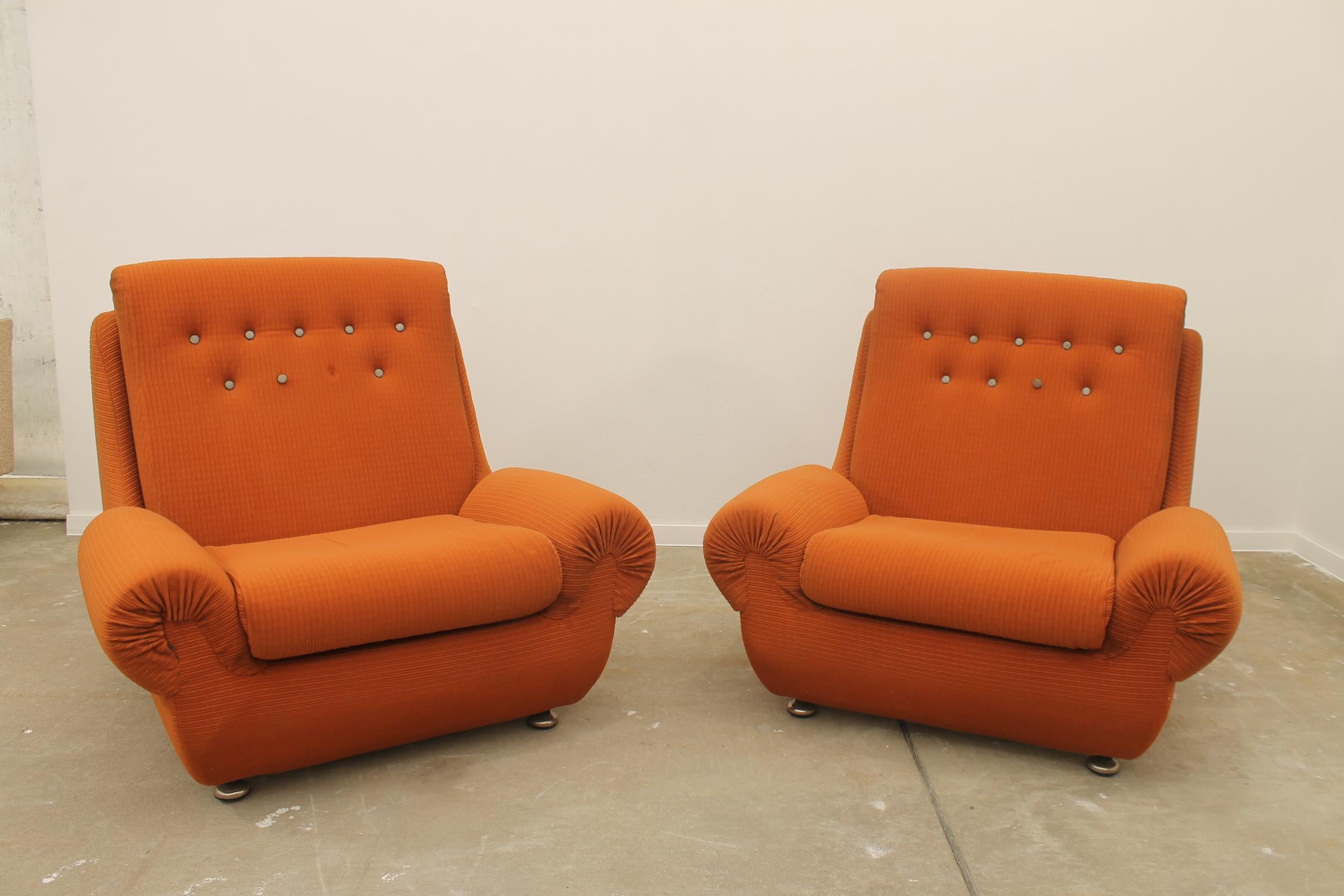 These armchairs was a part of a living room set made by JITONA company in the 1970´s.
They represent a typical example of furniture design of the 1970/1980s years of the 20th Century ´s in the former Czechoslovakia. 
The furniture is very