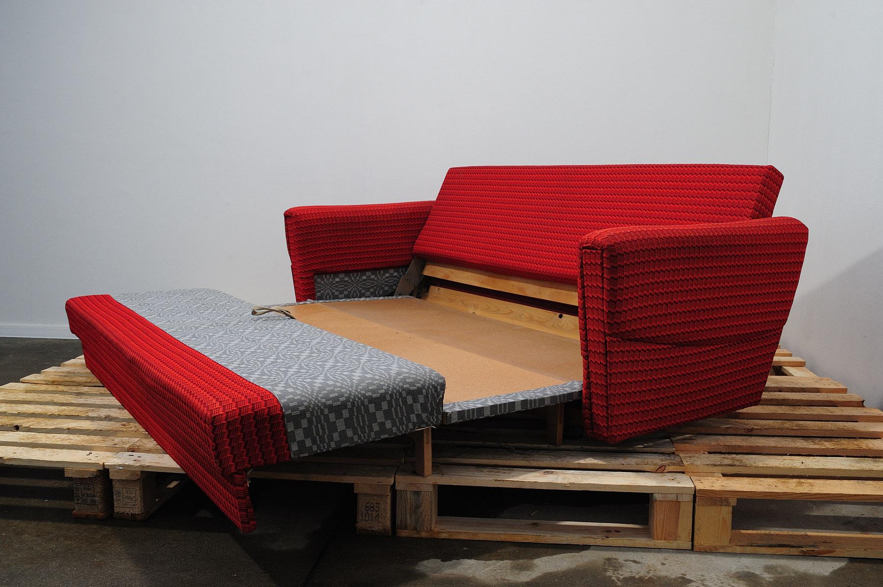 This living room set is a typical example of furniture design of the 1970/1980´s in the former Czechoslovakia.

The furniture is very comfortable.
It consists of one sofa and two armchairs on wheels. The set has original red upholstery, all in good