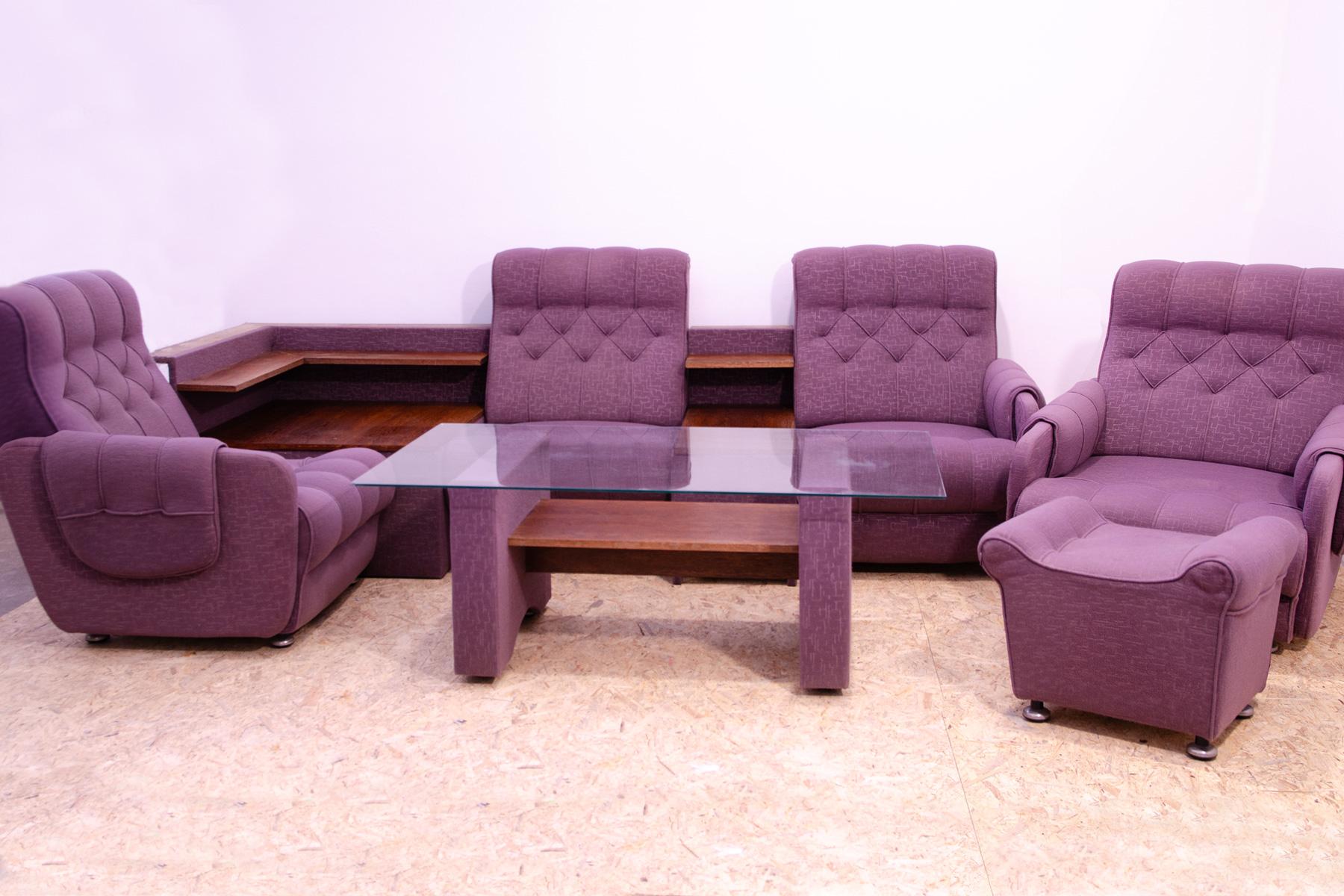 This vintage living room set is a typical example of furniture design of the 1970/1980´s in the former Czechoslovakia.

The furniture is very comfortable.
It consists of four armchairs conected together with a wooden side which serves as a side