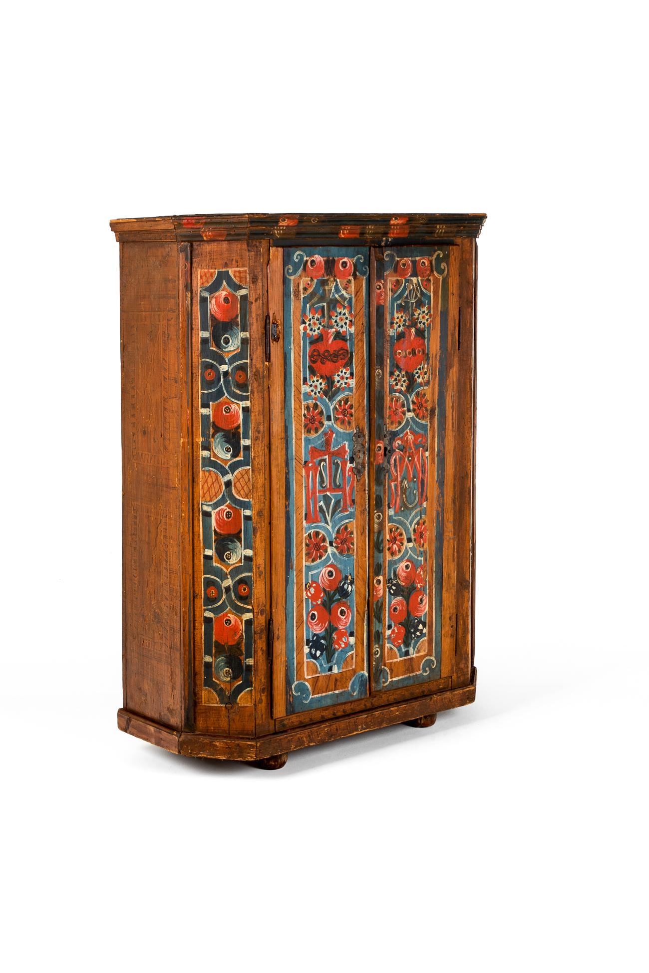 A splendid painted pine armoire or marriage cupboard in the folk art tradition.

Marriage cupboards were gifted to young married couples on their wedding day and frequently offered by their families to commemorate the special day.

Beautifully