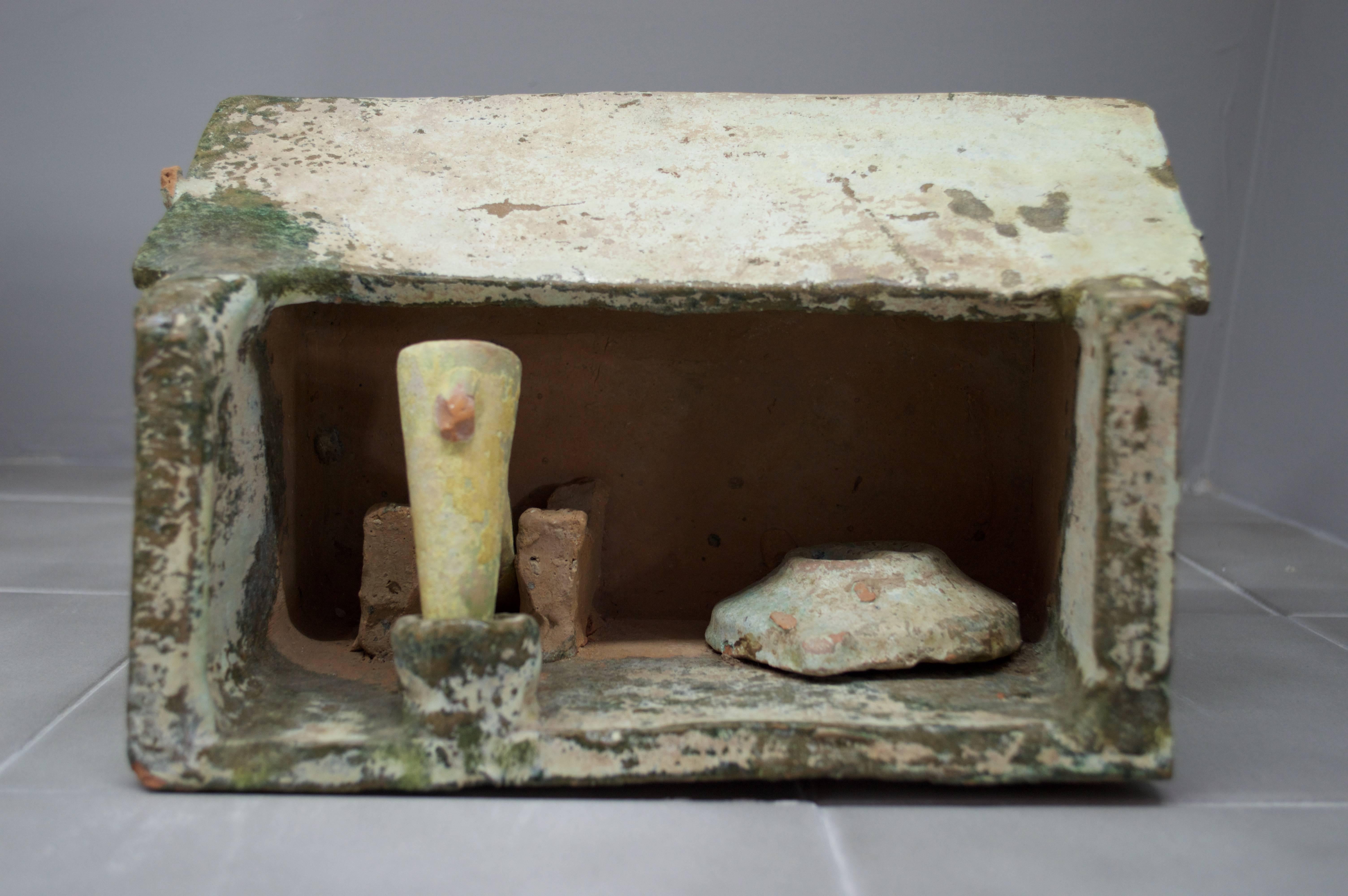 Slab pottery constructed Model of a Paper Mill, in Green and Cream Color Glazed Terracotta having a peaked roof – open walled form with a mechanical pounder and a large round storage container. Light blue-green mottled glazed surface with some