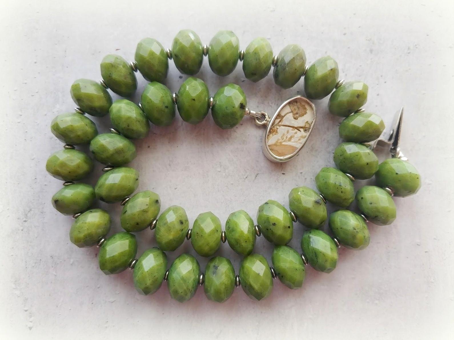 Canadian nephrite beaded necklace from Northern British Columbia.

The length of the necklace is 19 inches (48 cm). The size of the faceted rondelle beads is 15 mm. The nephrite beads are of excellent quality.
Nephrite beads are nontranslucent.
The