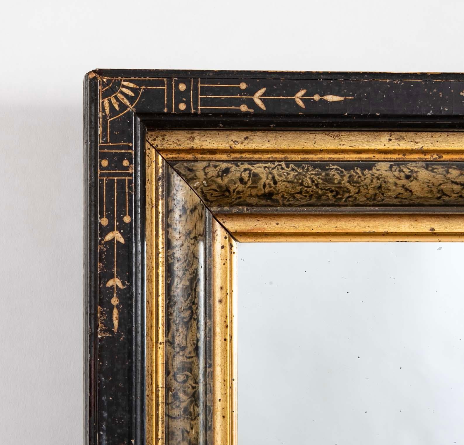 American Eastlake Ebonized Giltwood And Faux Marble Frame Mirror With Incised Decoration