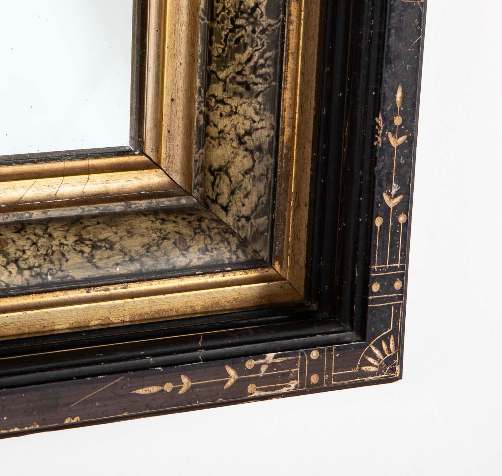 Eastlake Ebonized Giltwood And Faux Marble Frame Mirror With Incised Decoration In Good Condition In Stamford, CT
