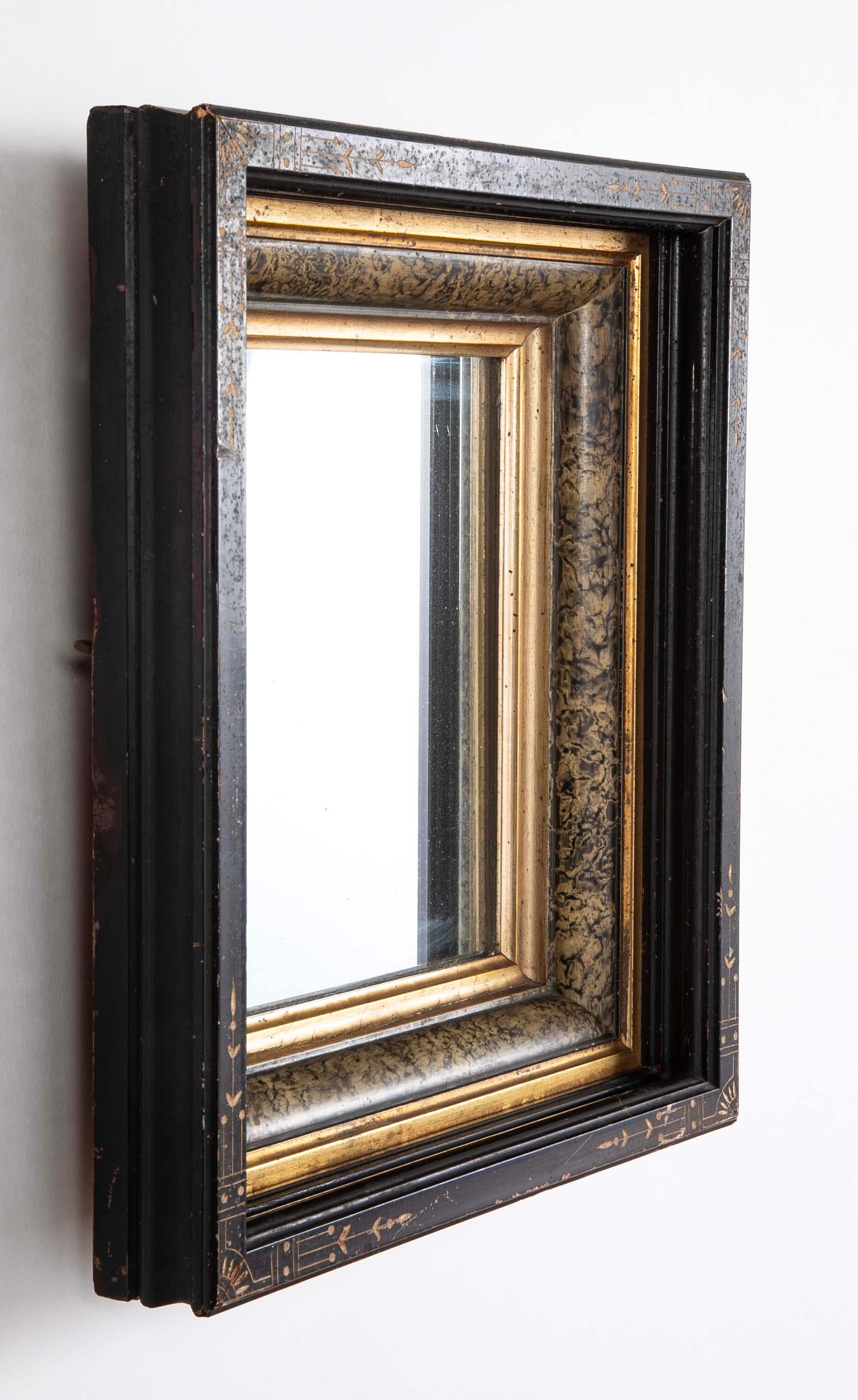 19th Century Eastlake Ebonized Giltwood And Faux Marble Frame Mirror With Incised Decoration