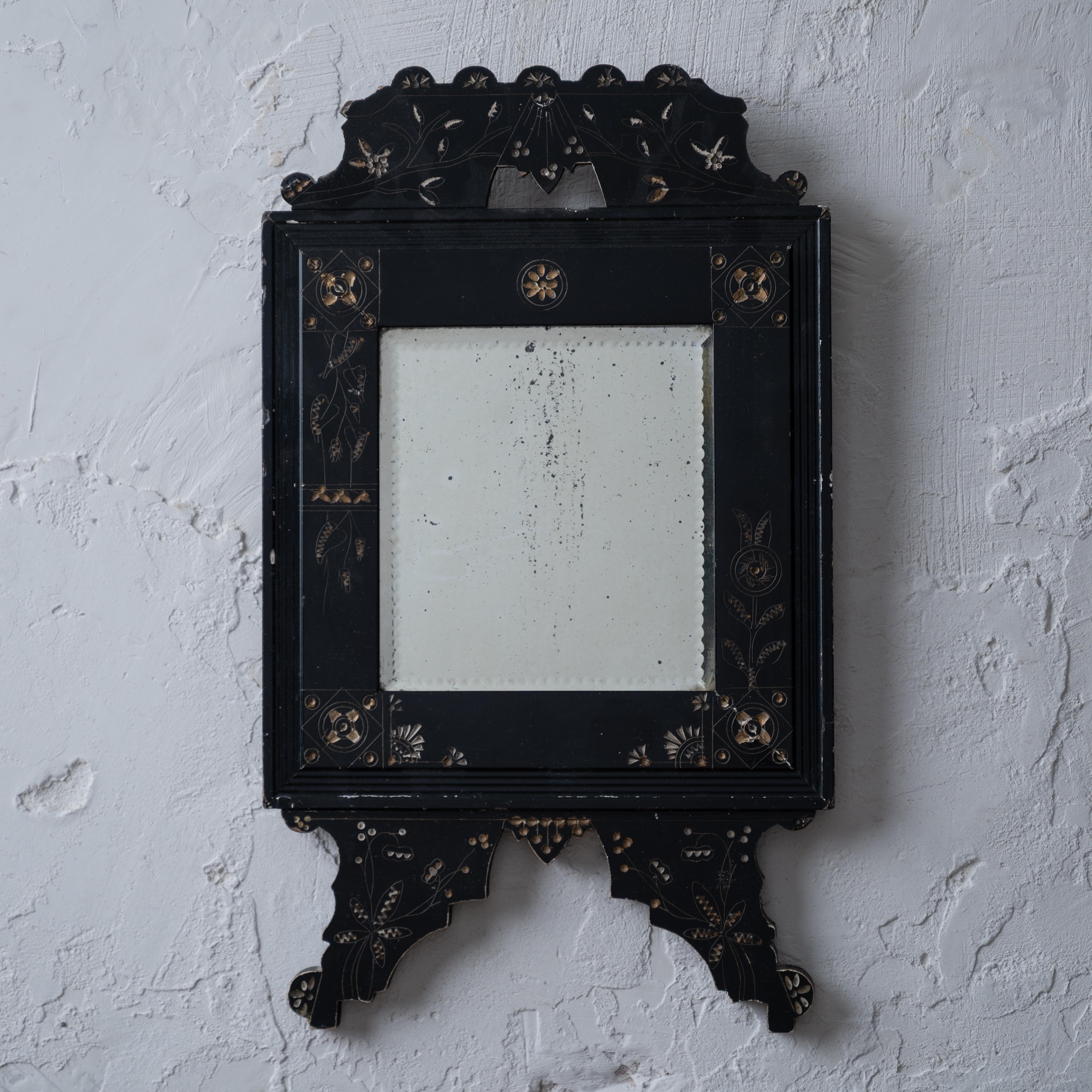 A small Eastlake mirror, circa 1880.

Originally an easel frame converted to hanging.



9 ½ inches wide by 1 inch deep by 16 ¼ inches tall; mirror plate 5 ½ by 6 inches



