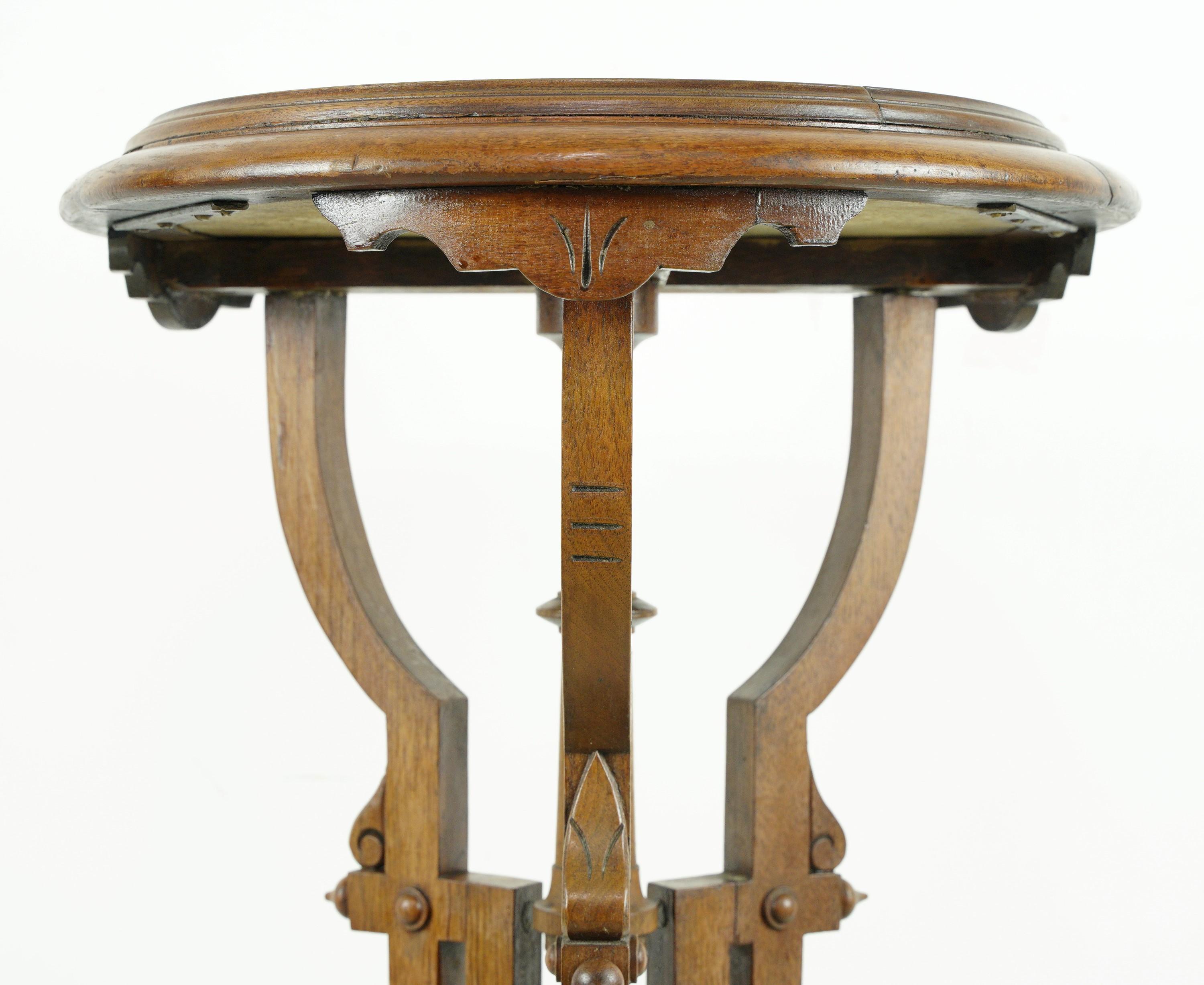 Early 20th century solid round oak side table or pendant featuring ornate Eastlake hand carvings and a matching round gray veined white marble top insert. Please note, one of the feet is slightly loose. Please note, this item is located in our