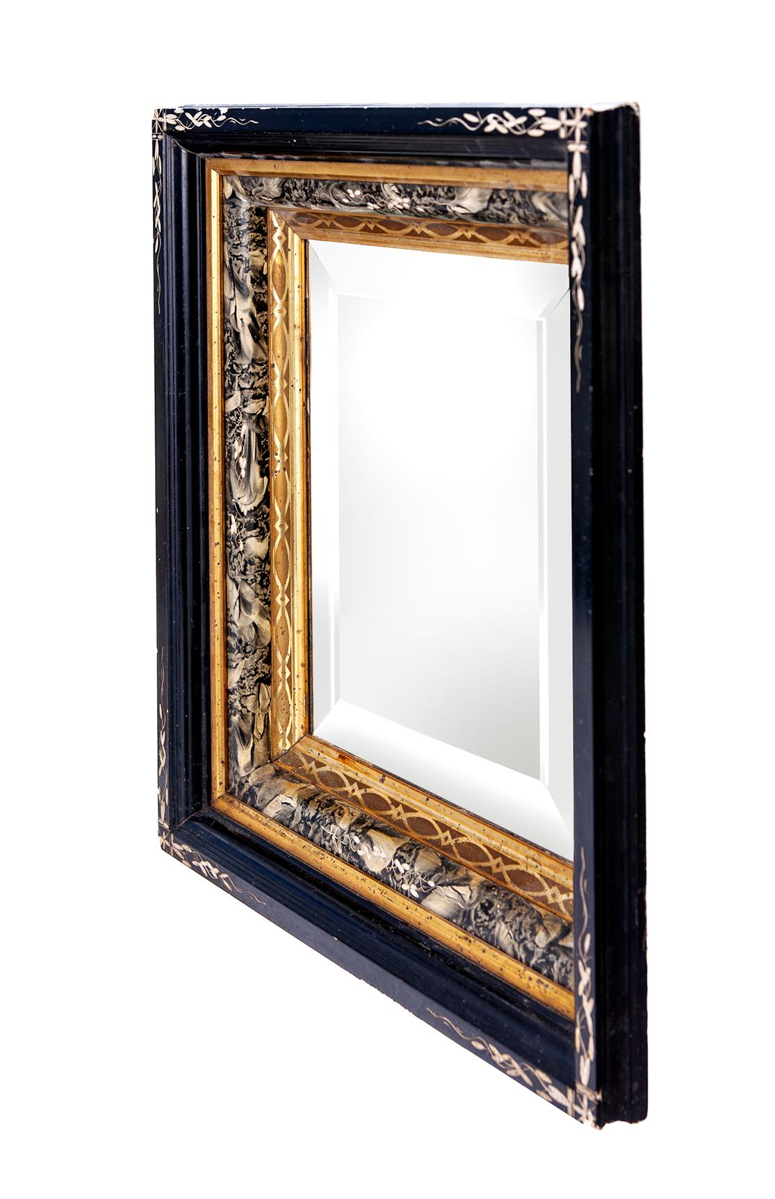 An antique 19th century Eastlake frame with decorative ebonized Incised border and gilt accents. Deep well frame with marblized inner frame.
The frame has a stunning “fossil” pattern surface with ebonized detailing and a lemon gilded stencil etched
