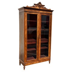 Eastlake Victorian carved walnut and burled wood bookcase