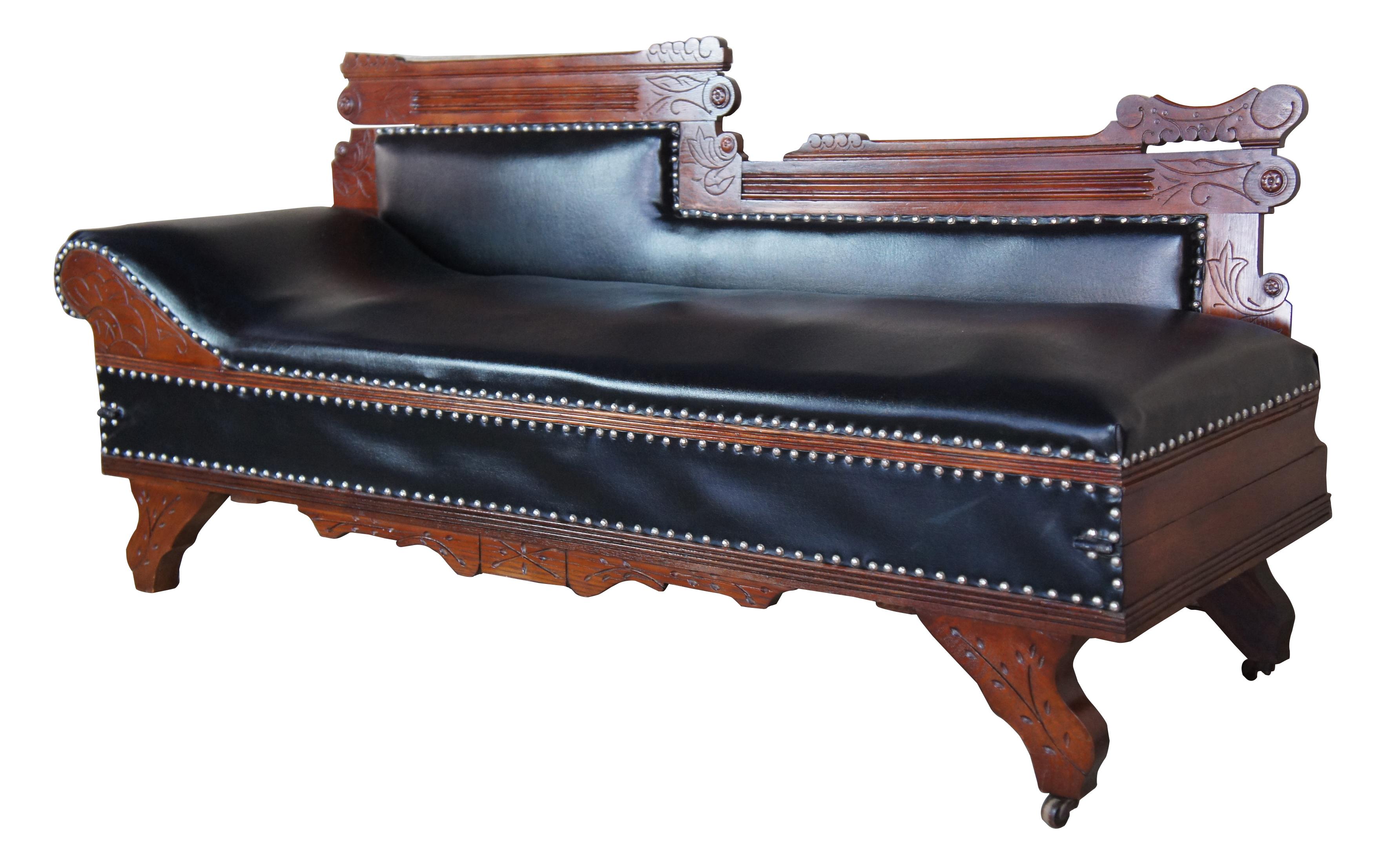 Eastlake Victorian oak leather chaise lounge fainting couch Murphy bed parlor

Eastlake chaise lounge day bed, circa 1880s. Made from red oak with carved trim and leather upholstery with nailheads. When it is not being used as a sofa or lounger,
