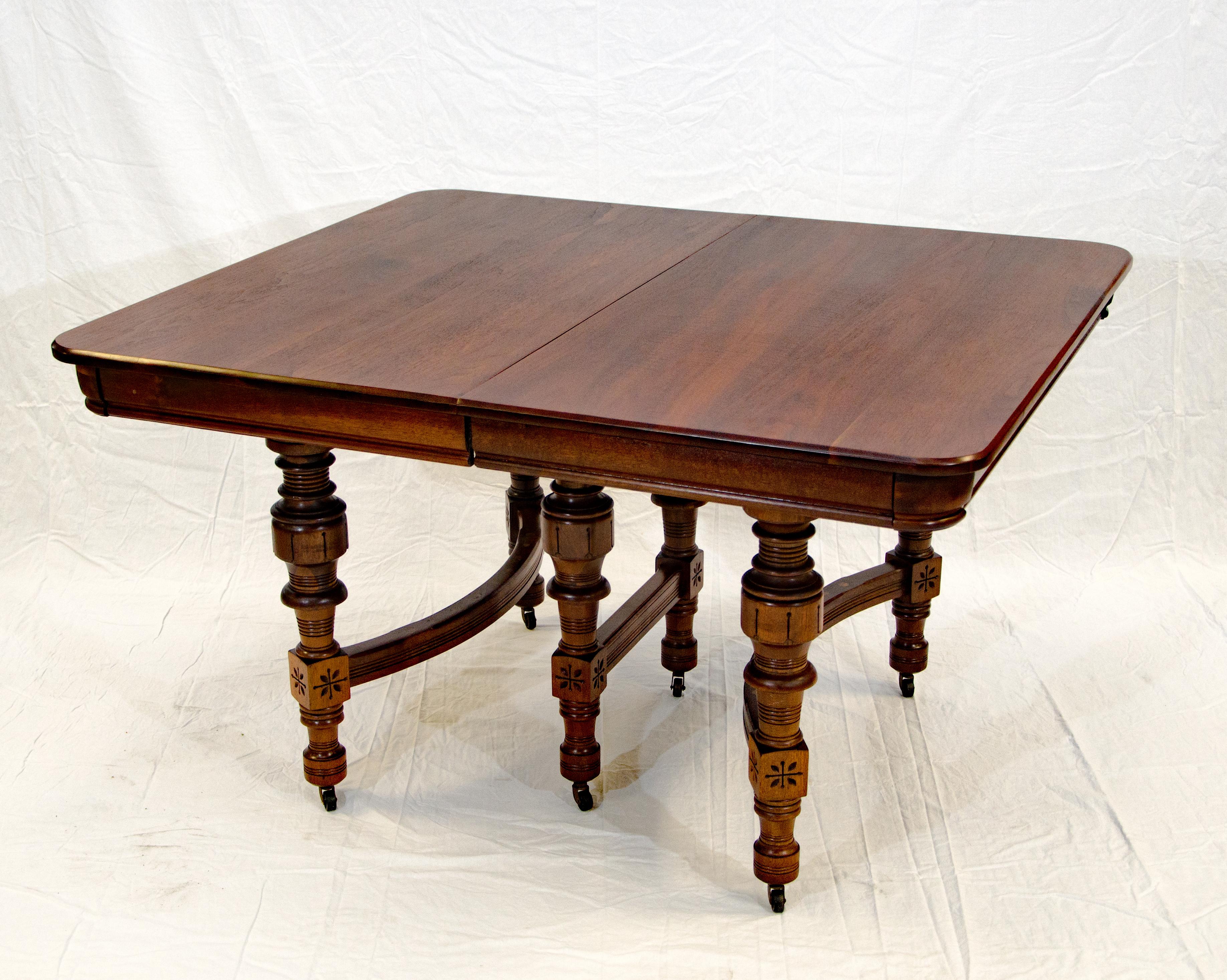 Very nice medium sized Eastlake Victorian walnut dining table with two leaves that measure 11 1/4