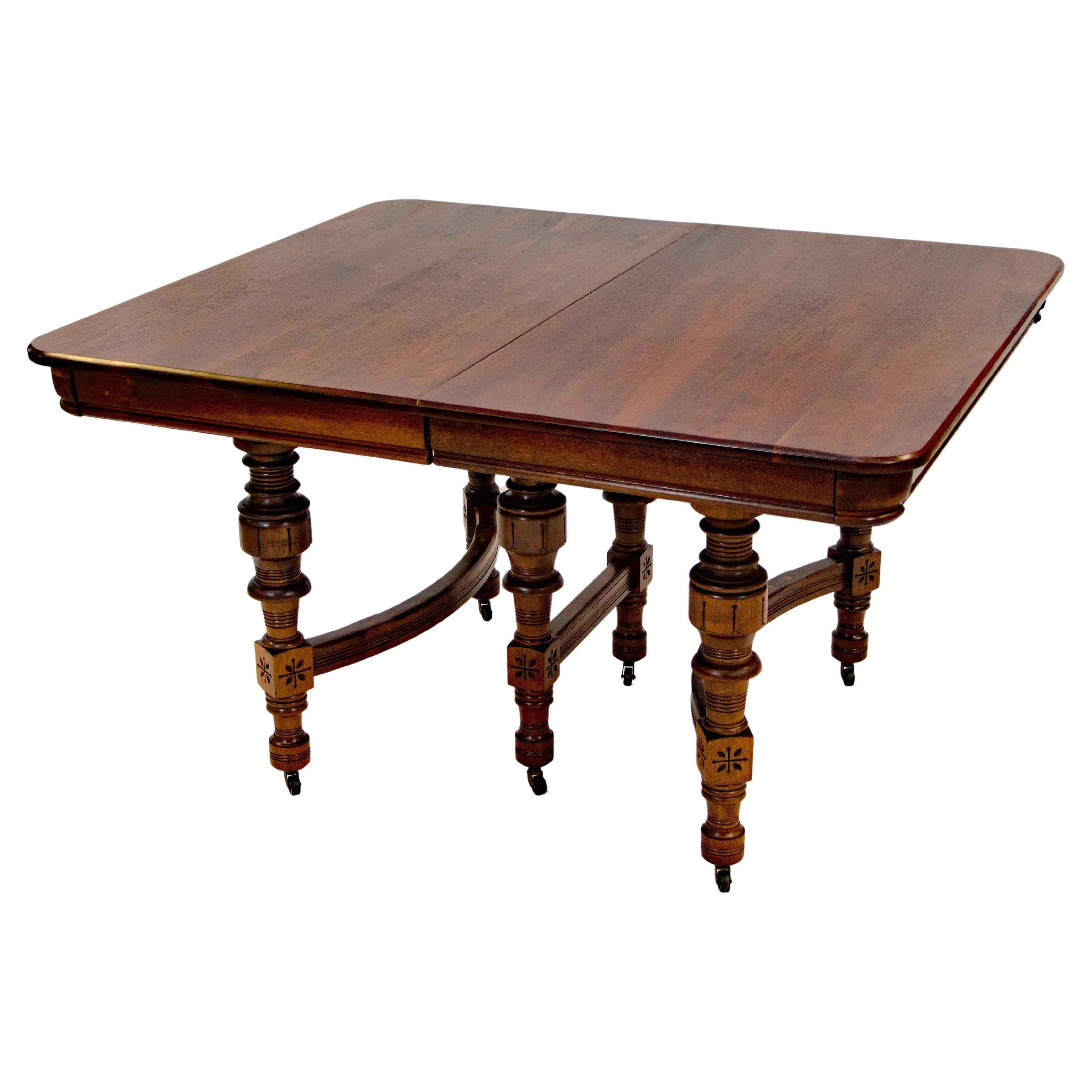 Eastlake Victorian Walnut Dining Table with Two Leaves For Sale