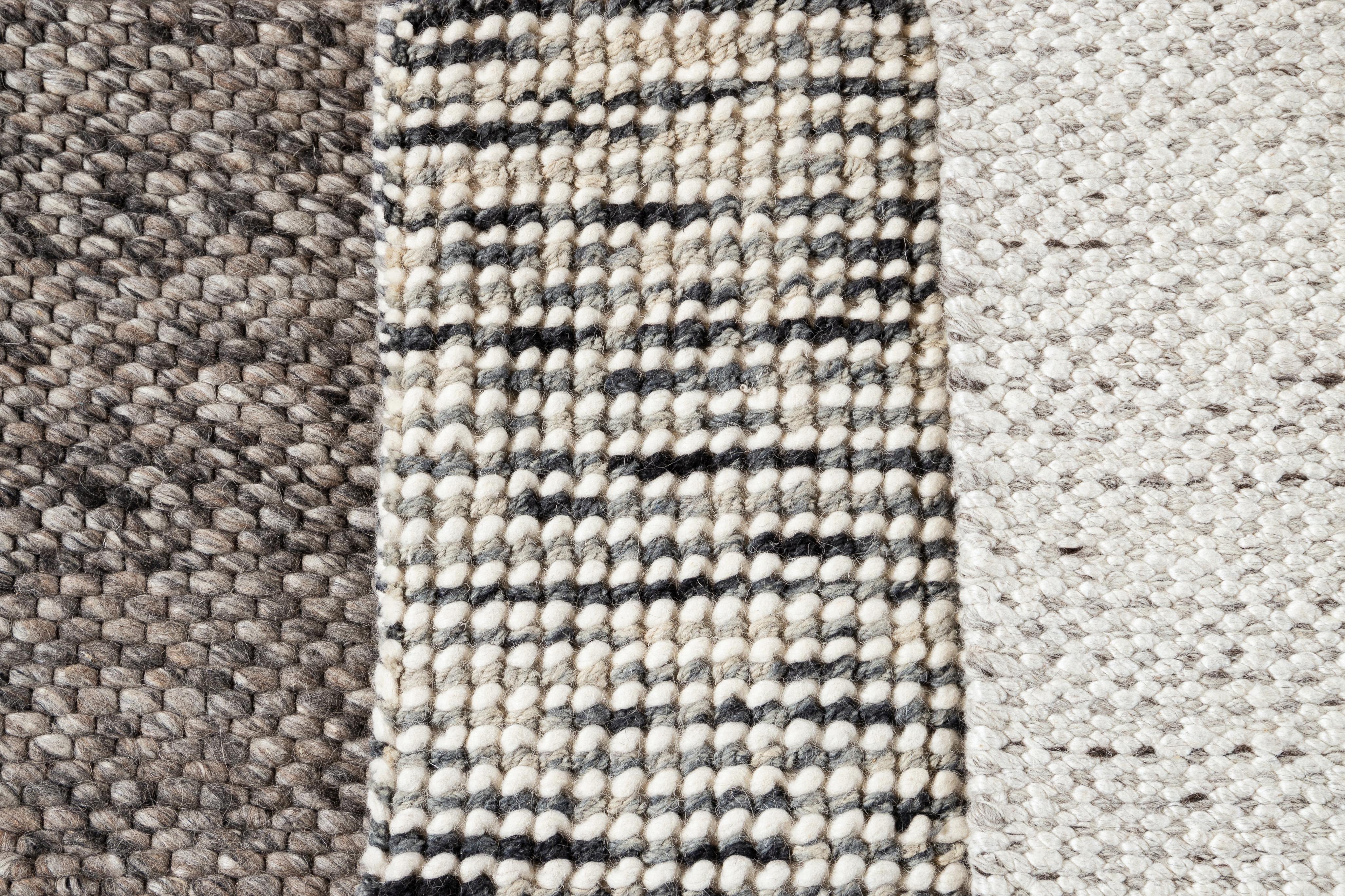 Handwoven wool textured custom rug in varying neutral shades. Custom sizes and colors made-to-order.

Collection: Easton
Material: 100% wool
Lead time: Approx. 12 weeks
Available colors: Charcoal, Blue-Grey, Lt. Silver 
Made in India

Price