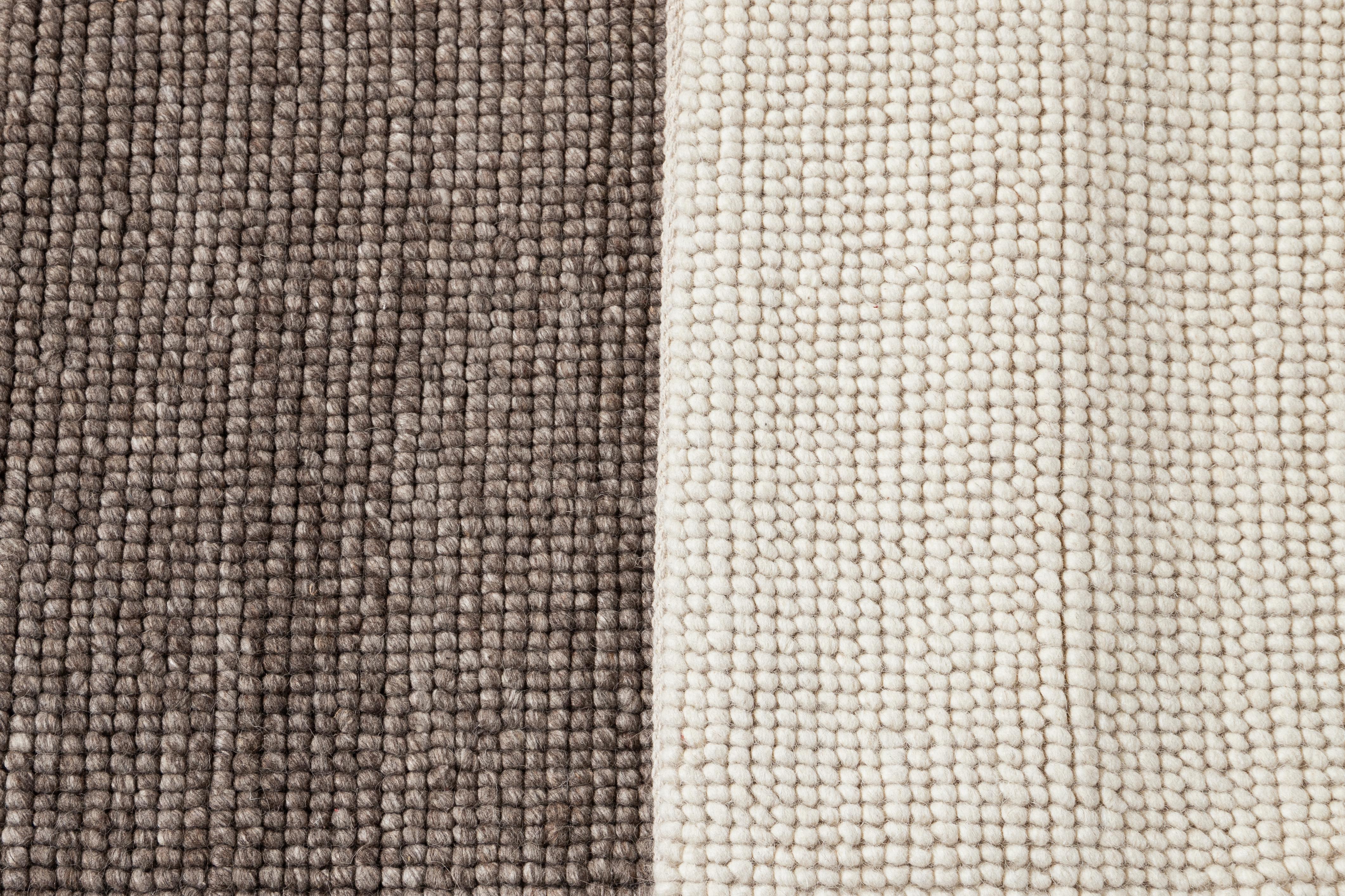 Solid-colored woven wool textured custom rug. Custom sizes and colors made-to-order.

Collection: Easton
Material: 100% wool
Lead time: Approx. 12 wks
Available Colors: Beige, white
Made in India

Price listed for an 8' x 10' rug.