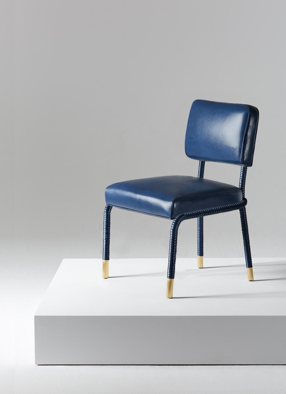 And Objects, product design studio founded by Martin Brudnizki and Nick Jeanes based in London.

The Easton side chair is uniquely crafted from stainless steel and Italian leather. Hand-wrapped leather cloaks a tubular frame ending with brass accent