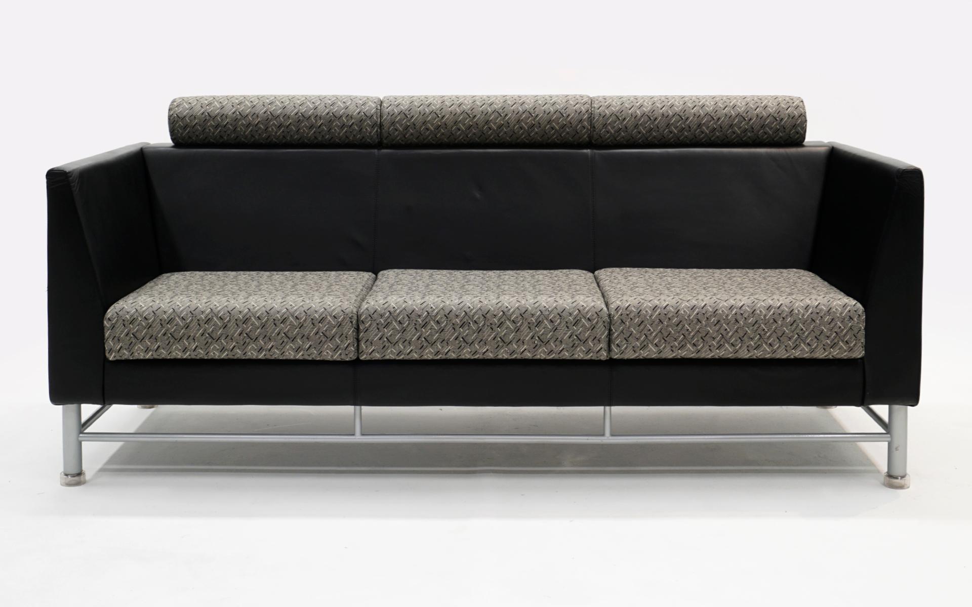 Eastside Sofa by Ettore Sottsass and manufactured by Knoll, 1980s. Original black leather and gray and black patterned fabric. Aluminum and steel base construction. There are no tears significant scratches or repairs to the leather. There are a two