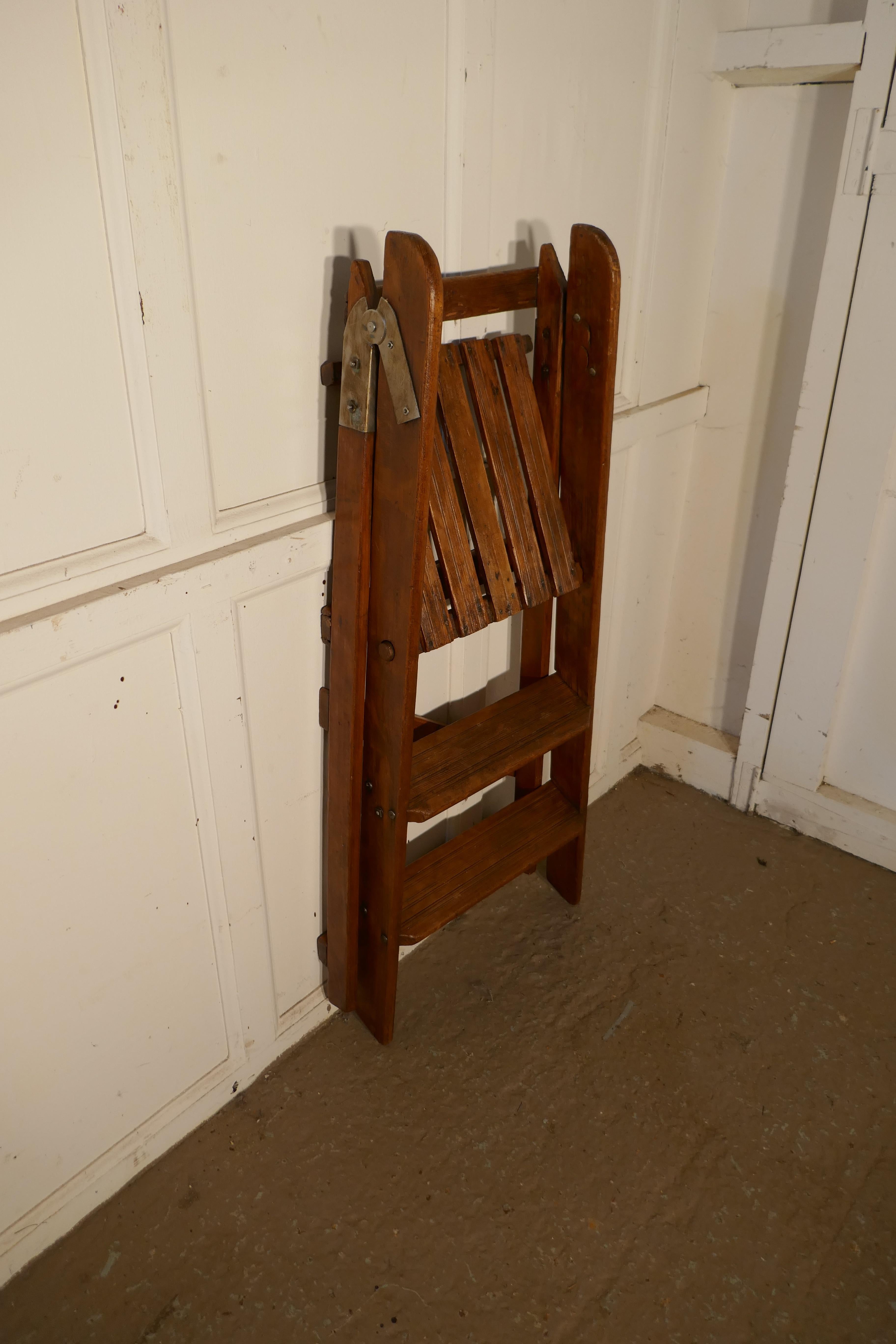 Easy action pine step kitchen step ladder 

This is a very useful and attractive piece, the step ladder has 3” treads, it folds flat for handy storage and would work well in a kitchen or shop, library or anywhere where a little extra height would
