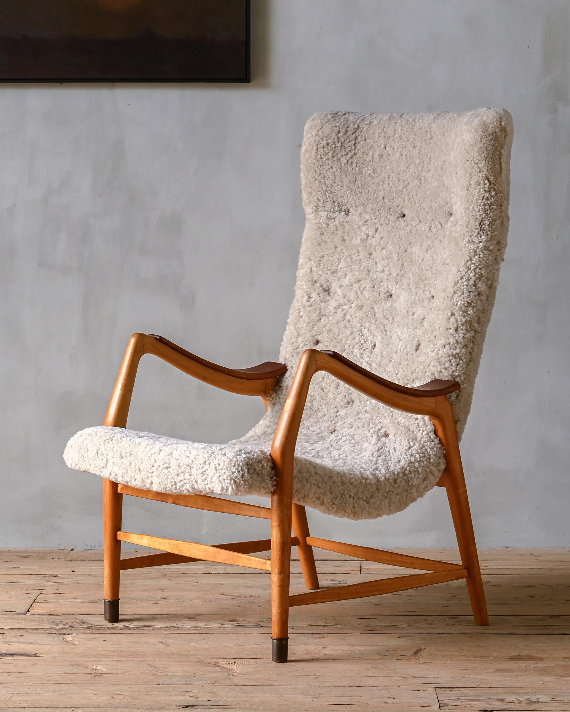 Rare easy chair reupholstered in sheepskin by Bertil Fridhagen for Bodafors, 1940s, Sweden.