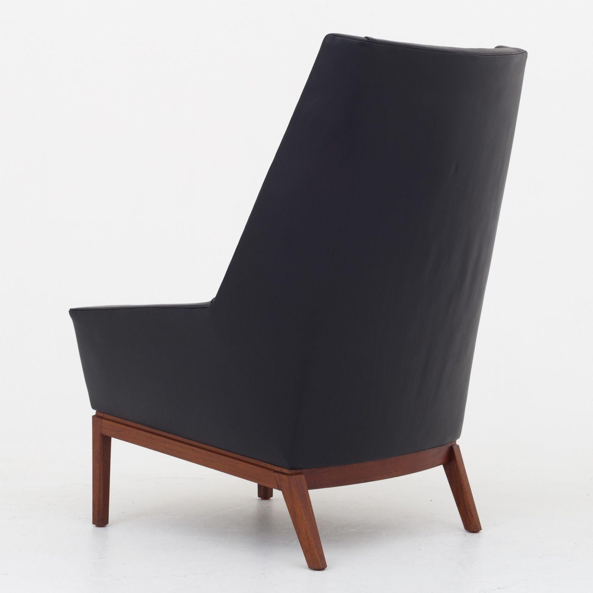 Tall easy chair in black Canyon leather w. frame of teak. Erik Koling Andersen / Peder Pedersen.