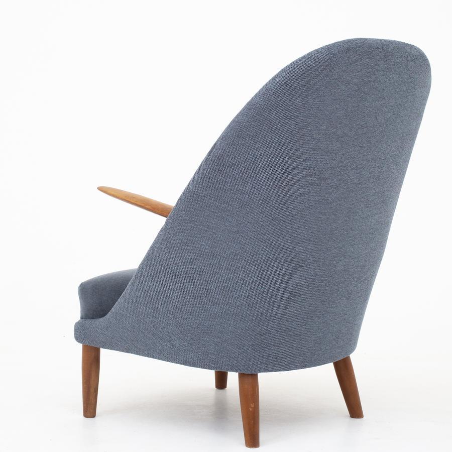 Easy chair in new wool (Clay, code 001 and seat in Byram, code 171). Frame of beech. Maker Rolshau Møbler.
