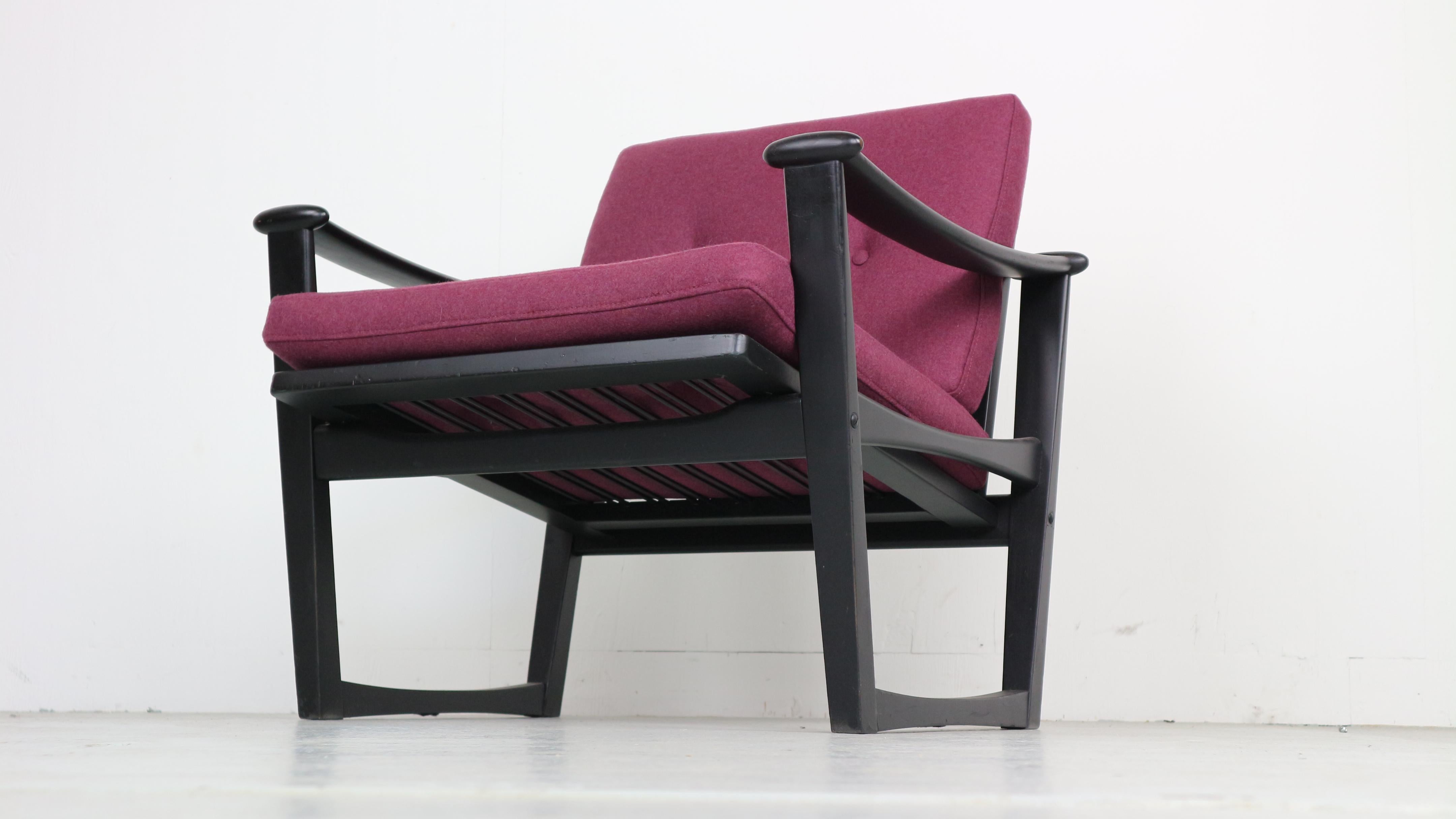 Spade chair in mat black lacquered oak. New cushions with purple wool fabric.
Design by Finn Juhl.
Produced by Pastoe in The Netherlands
1960s