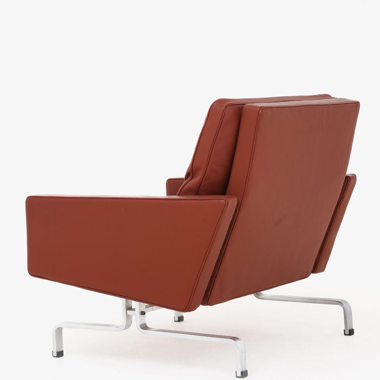 PK 31/1 - Easy chair in red leather on chromed steel frame. Poul Kjærholm / E. Kold Christensen.
