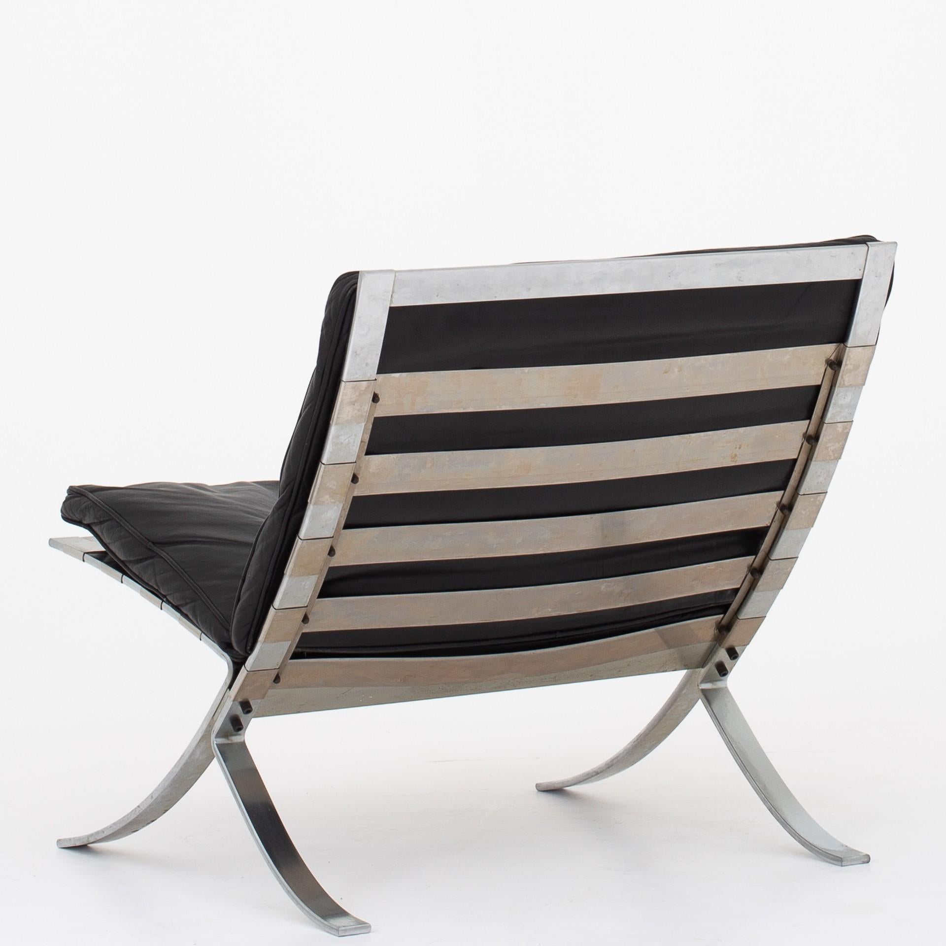 Tango easy chair in original, black leather and frame of steel. Maker Terrex Art. Designed 1968.
