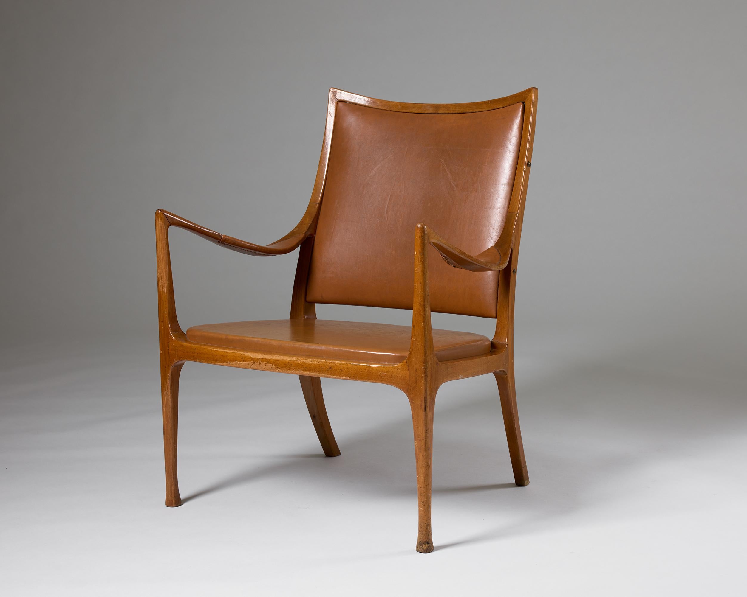Fauteuil facile conçu par Hans Asplund pour Nordiska Kompaniet, Suède, 1955.

Noyer et cuir.

Ce rare fauteuil, conçu par Hans Asplund pour Nordiska Kompaniet en 1955, est un exemple du design moderne suédois du milieu du siècle dernier. Conçues sur