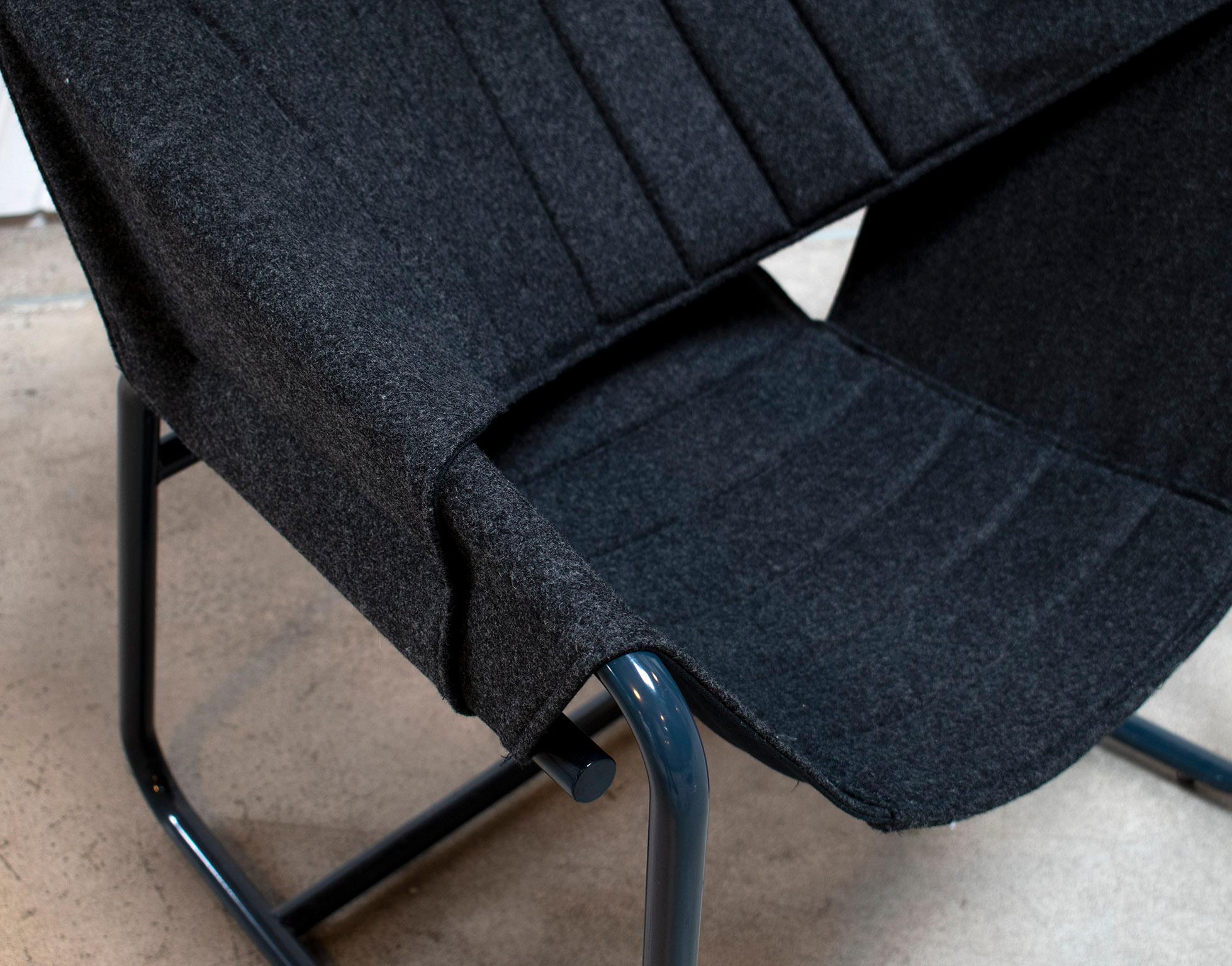 The easy chair combines the casual vibe of sling chairs with the cozy comfort of a Classic club chair all in a floating form reminiscent of midcentury shell chairs. The top layer of the quilted sling is available in a choice of upholstery fabrics