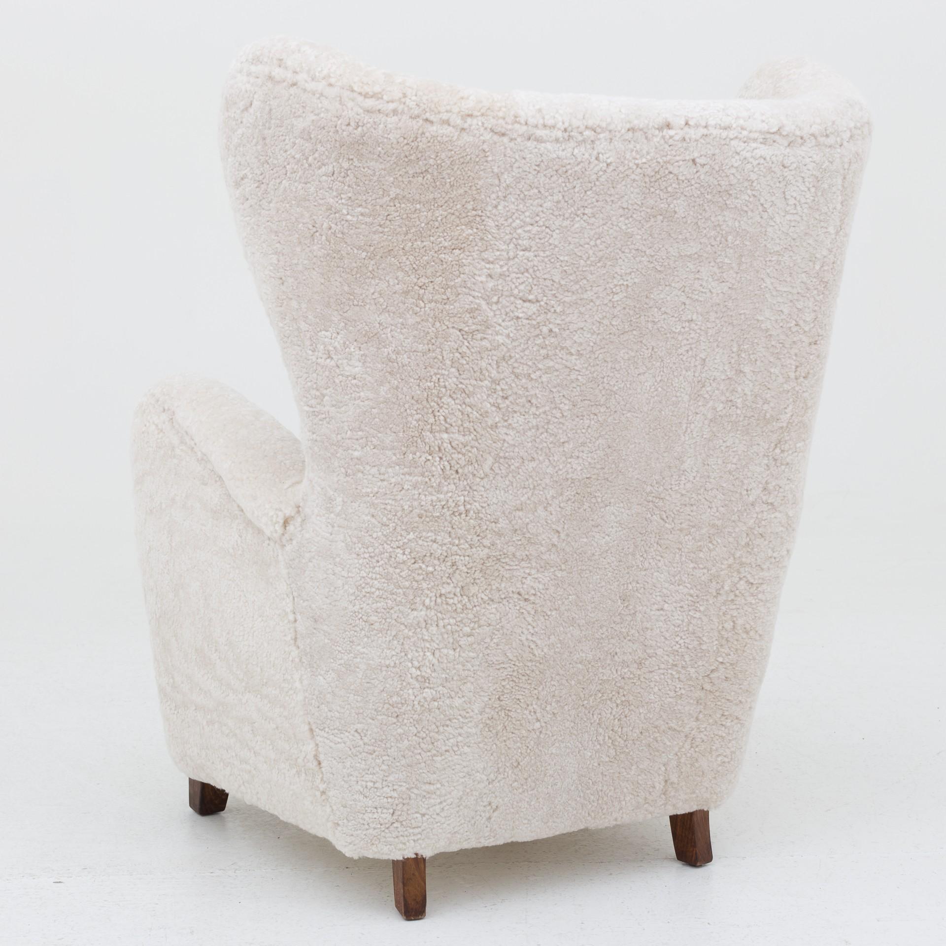 Reupholstered easy chair in lambs wool (Moonlight 09).