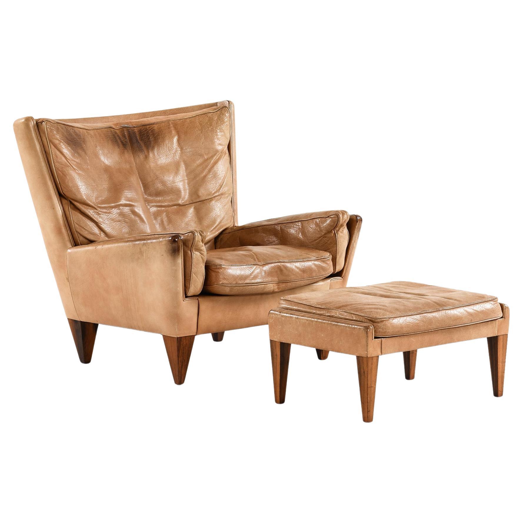 Easy Chair in Leather and Rosewood with Stool by Illum Wikkelsø, 1960s For Sale