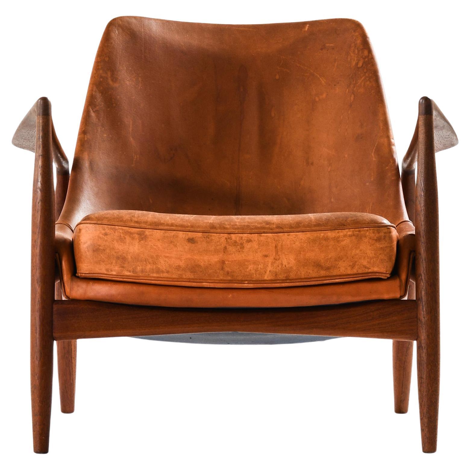 Easy Chair in Leather and Teak by Ib Kofod-Larsen, 1950s