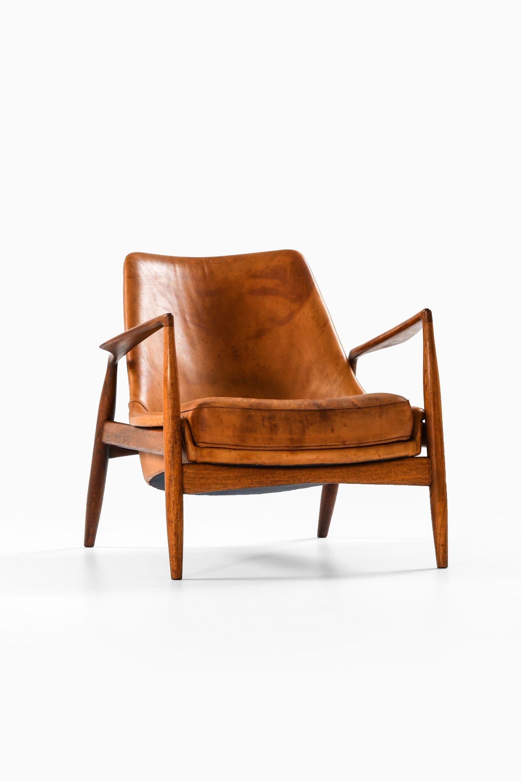 Mid-Century Modern Fauteuil en teck et cuir cognac original par Ib Kofod-Larsen, années 1950 en vente