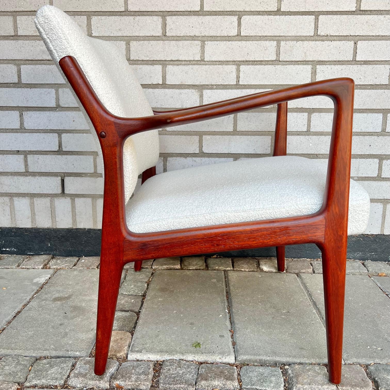 Rare chair designed by Karl-Erik Ekselius, produced by JOC in Vetlanda, Sweden, 1960s.

Solid teak frame and newly upholstered cushions in bouclé wool fabric