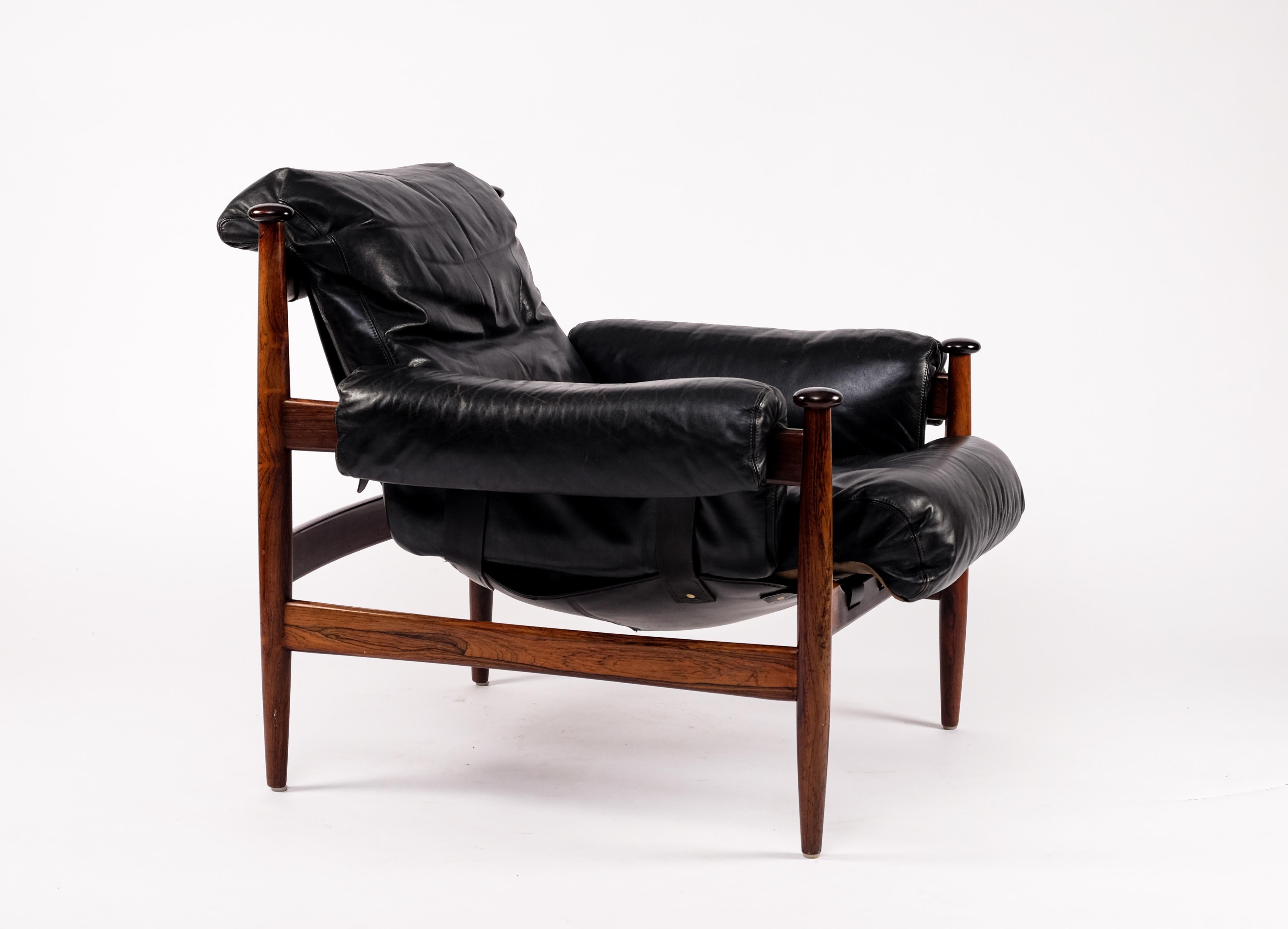 Original black leather, model Amiral. Produced in the 1960s by IRE möbler in Skillingaryd, Sweden.
  
