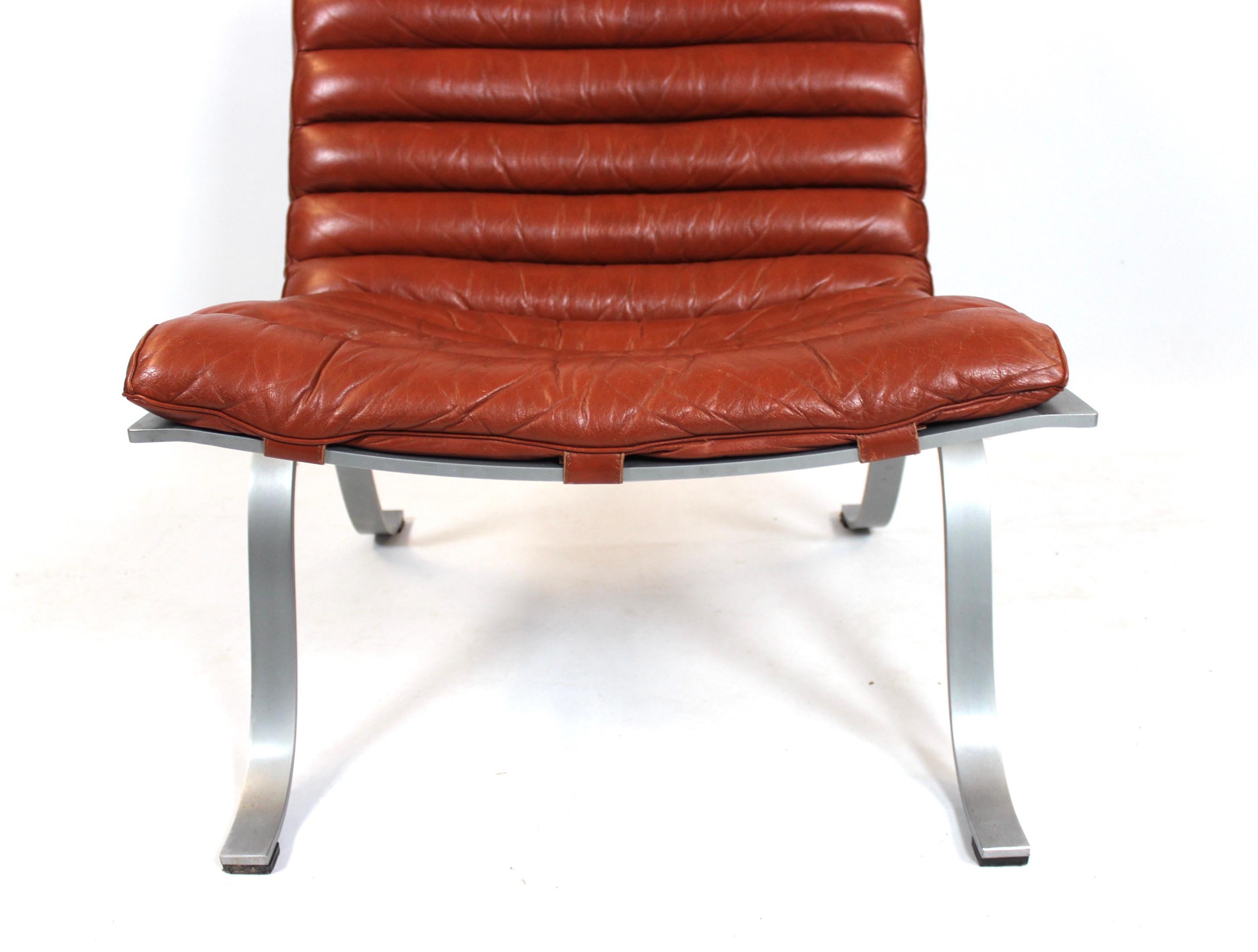 Scandinavian Modern Easy Chair, Model Ariet, of Red Leather and Steel Frame Designed by Arne Norell