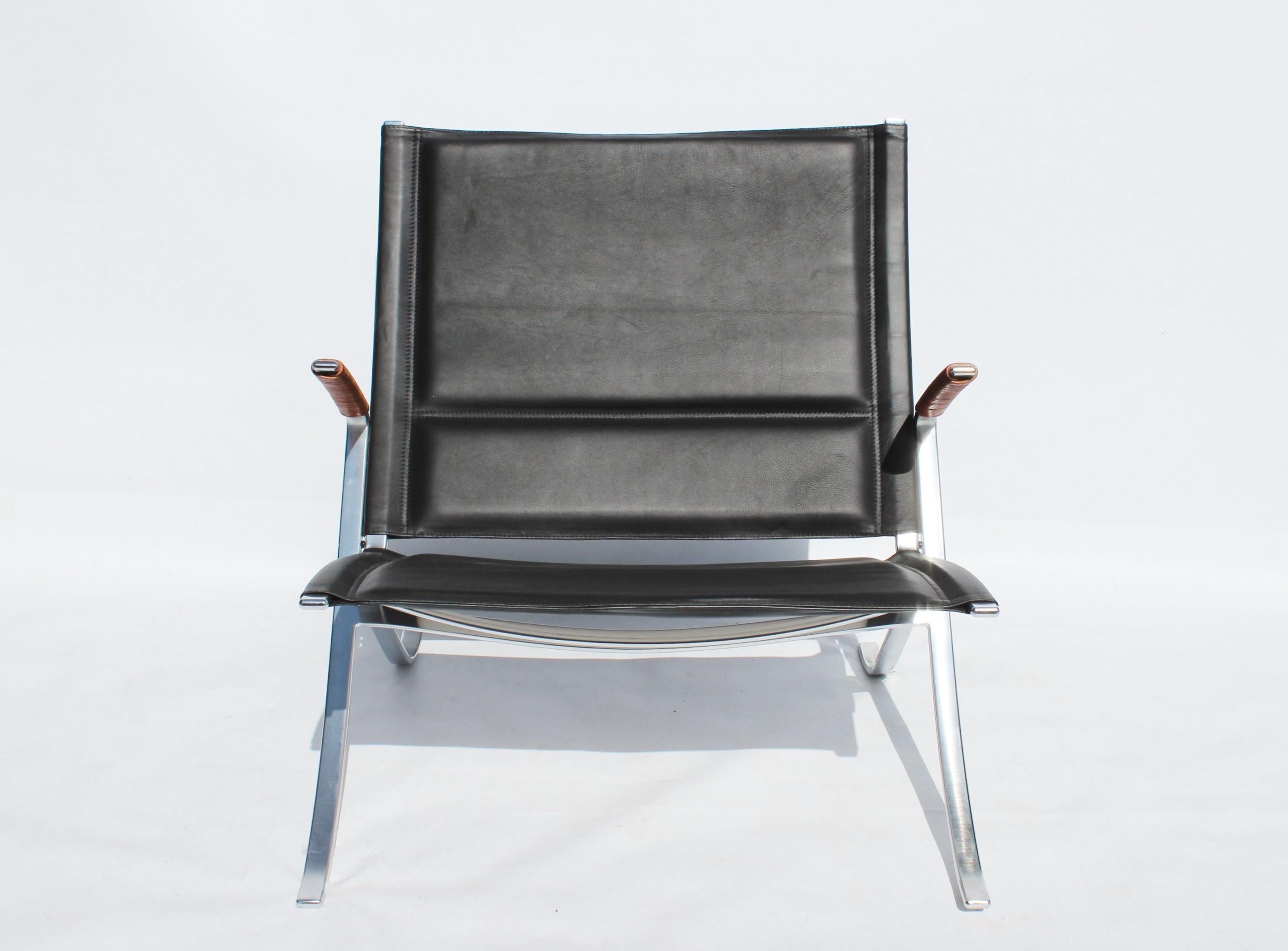 Easy chair, model FK82 - X-chair, designed by Preben Fabricius and Jørgen Kastholm in 1968 and manufactured by Lange Production. The chair is upholstered with black leather and is in good condition.