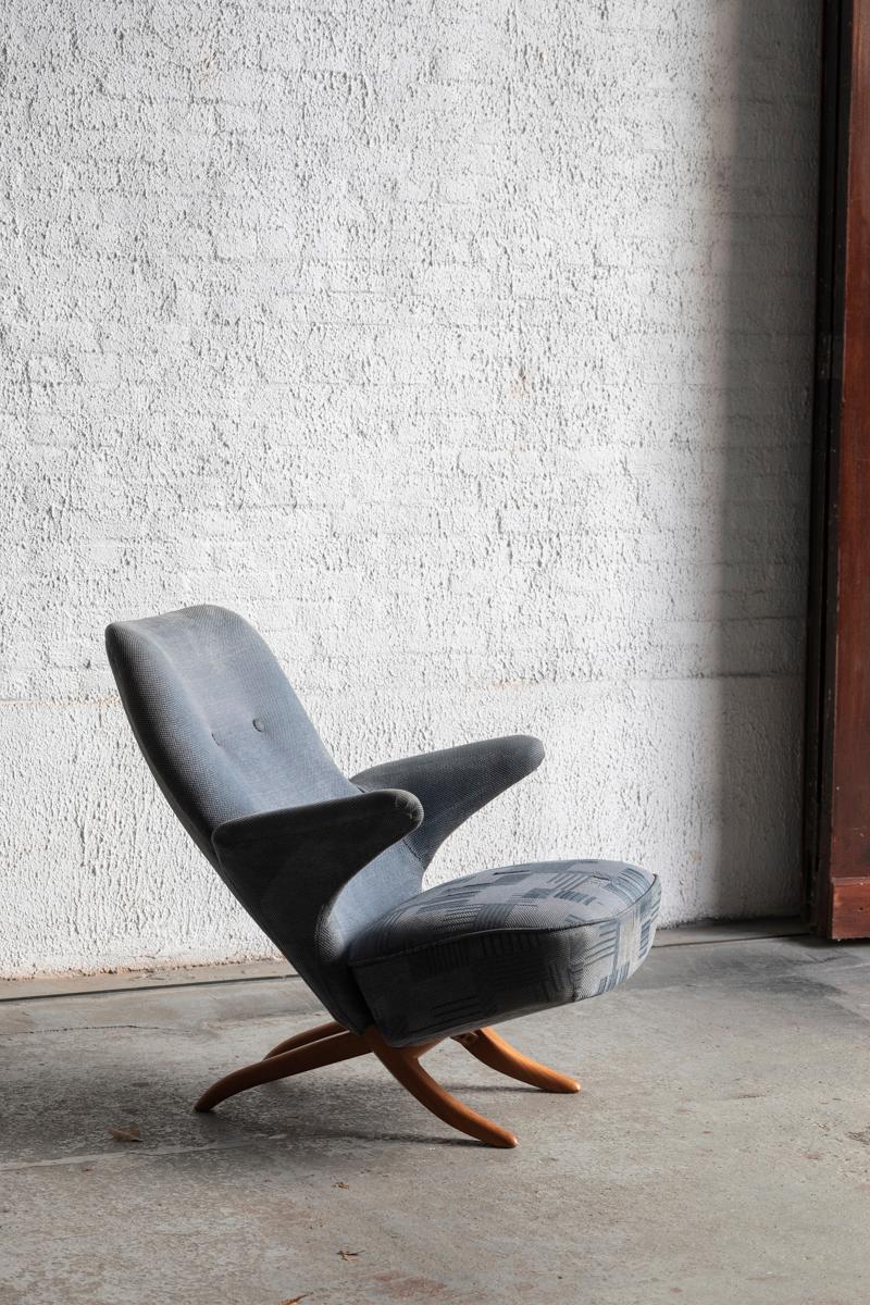 Penguin Easy chair designed by Theo Ruth and produced by Artifort in the Netherlands around 1960. This chair was designed as part of a collection, with other pieces such as the Congo chair which features the same joinery method. The chair has a blue