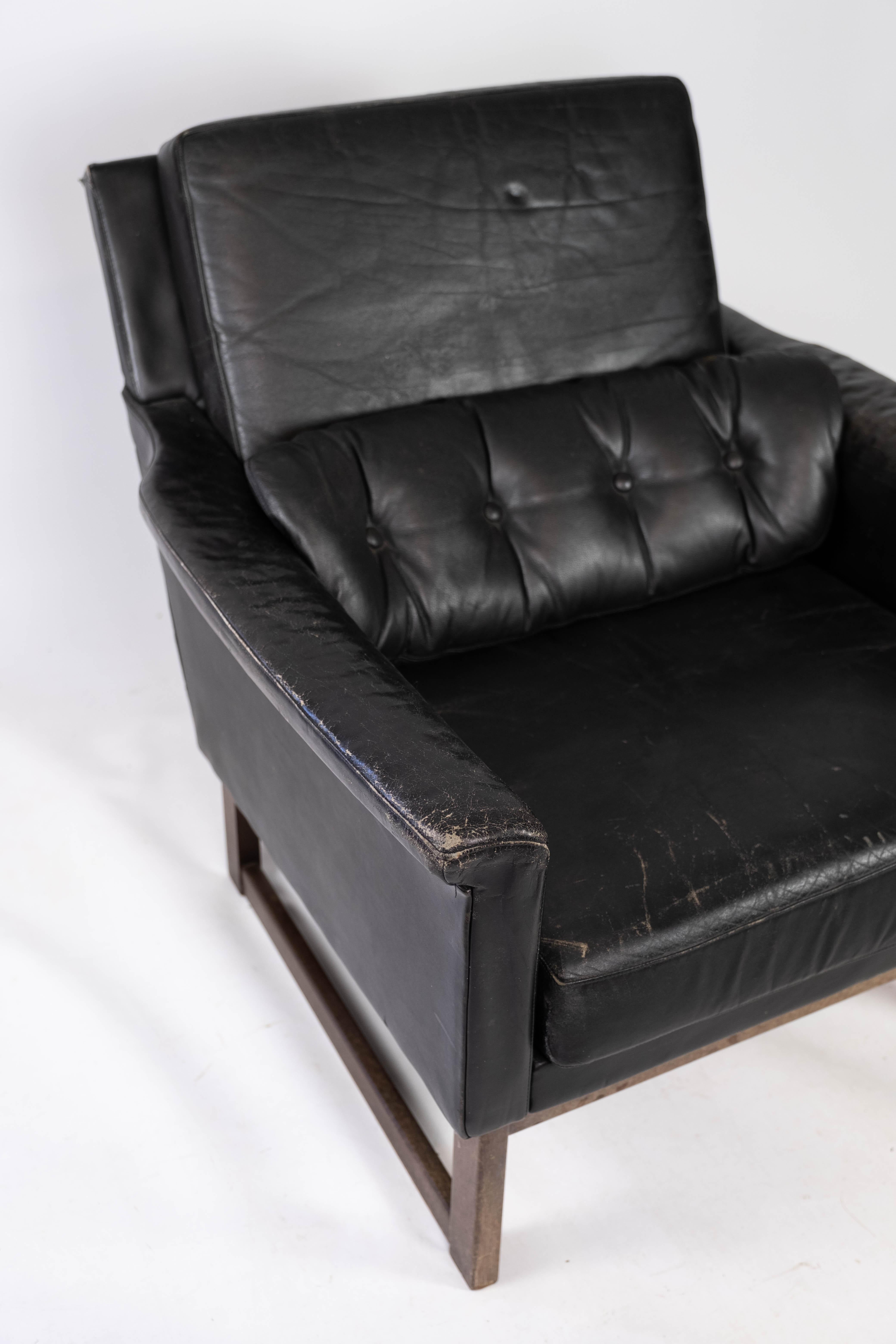 Scandinavian Modern Easy Chair Upholstered with Black Leather and Legs in Wood, by Illum Wikkelsø