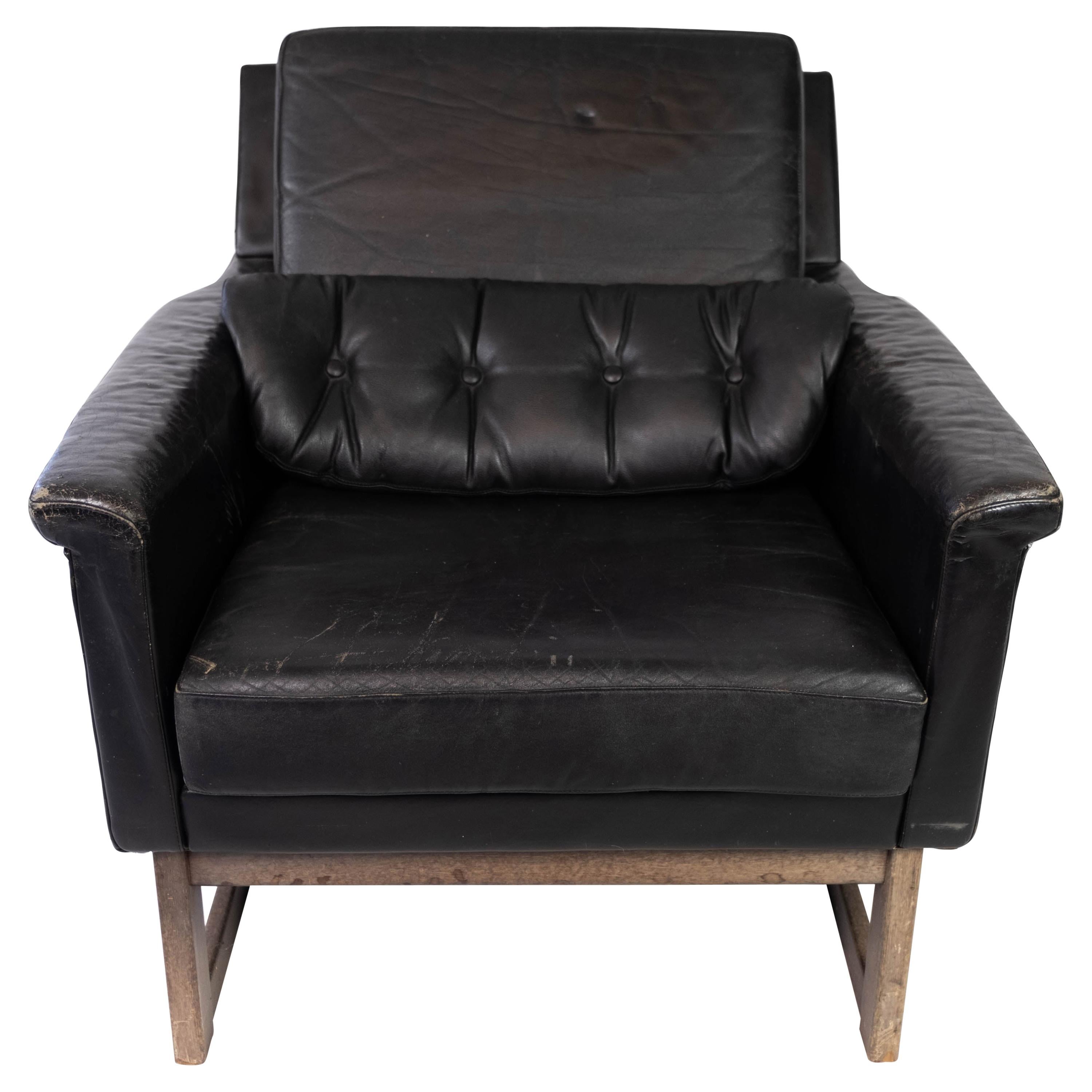 Easy Chair Upholstered with Black Leather and Legs in Wood, by Illum Wikkelsø