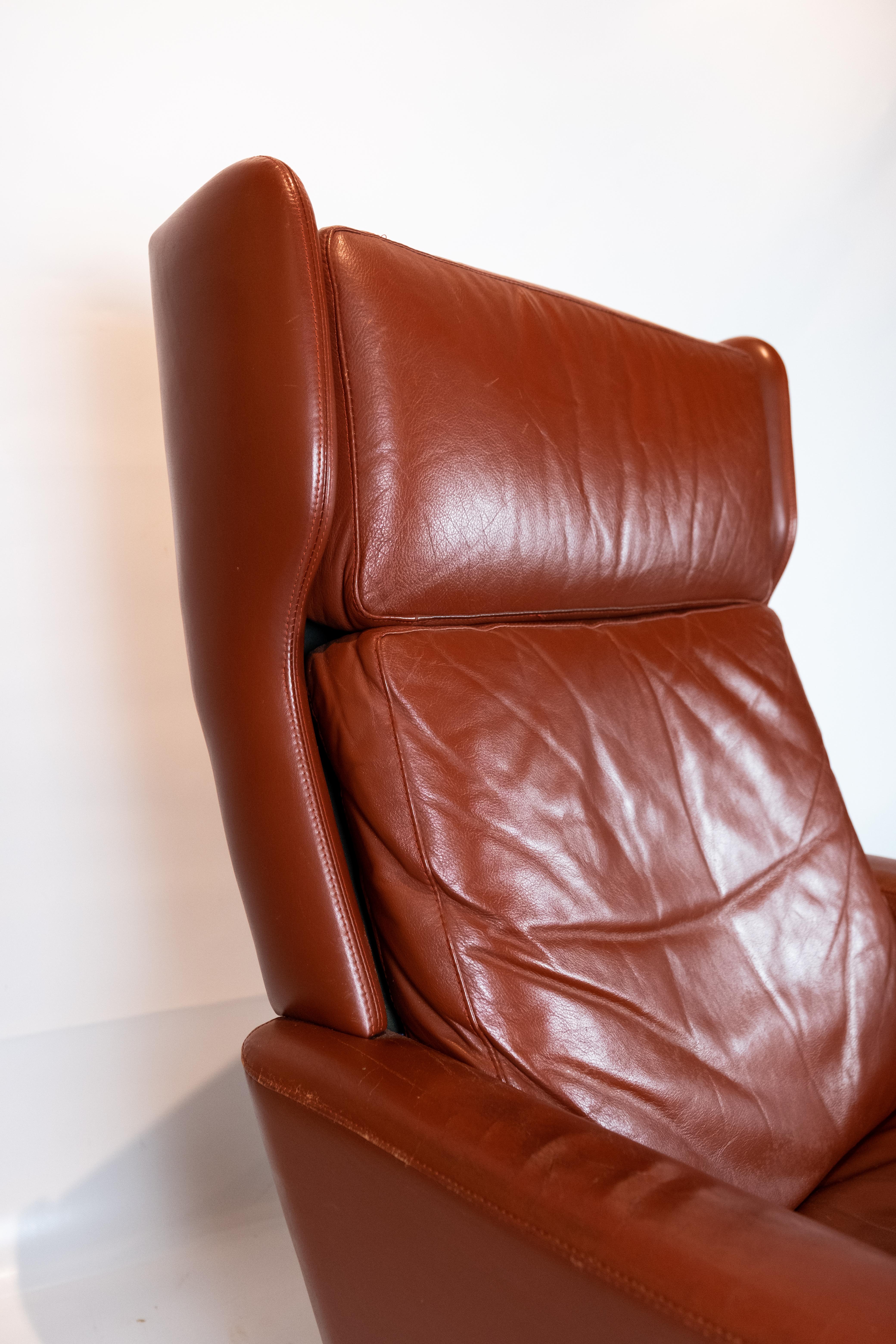 Easy chair upholstered with red brown elegance leather of Danish design from the 1970s. The chair is in great vintage condition.
 